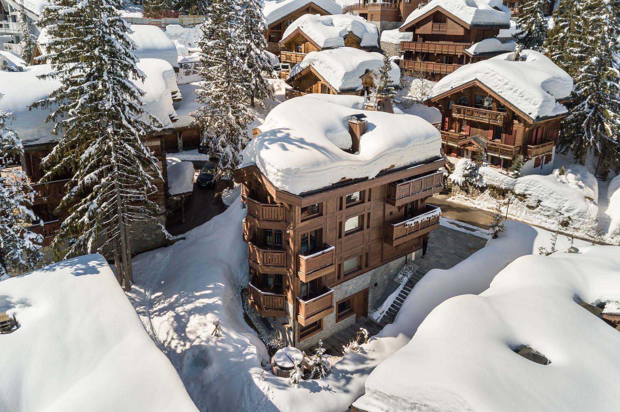 chalet-macha-exterior-aerial-snow-mountainview-luxuryretreat-rental-courchevel1850-luxury