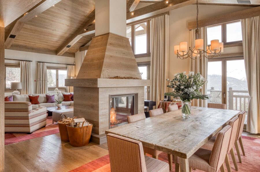 chalet-sheena-fireplace-diningroom-openplan-mountainview-luxury-alpine-interior-courchevel1850