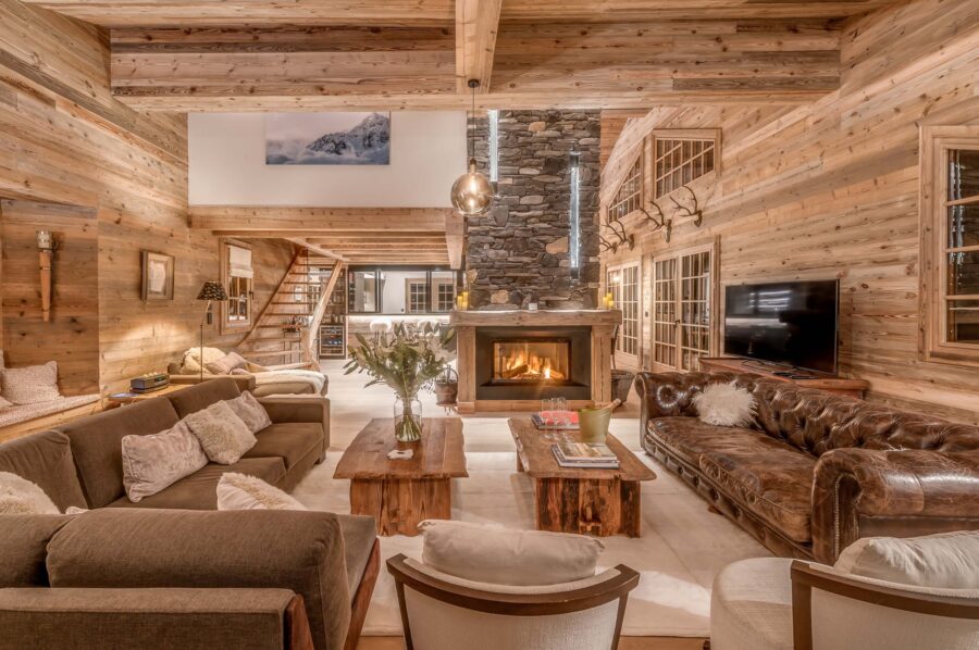 Chalet-nama-mainpage-livingroom-luxury-cosy-alpine-interior-fireplace-courchevel1850