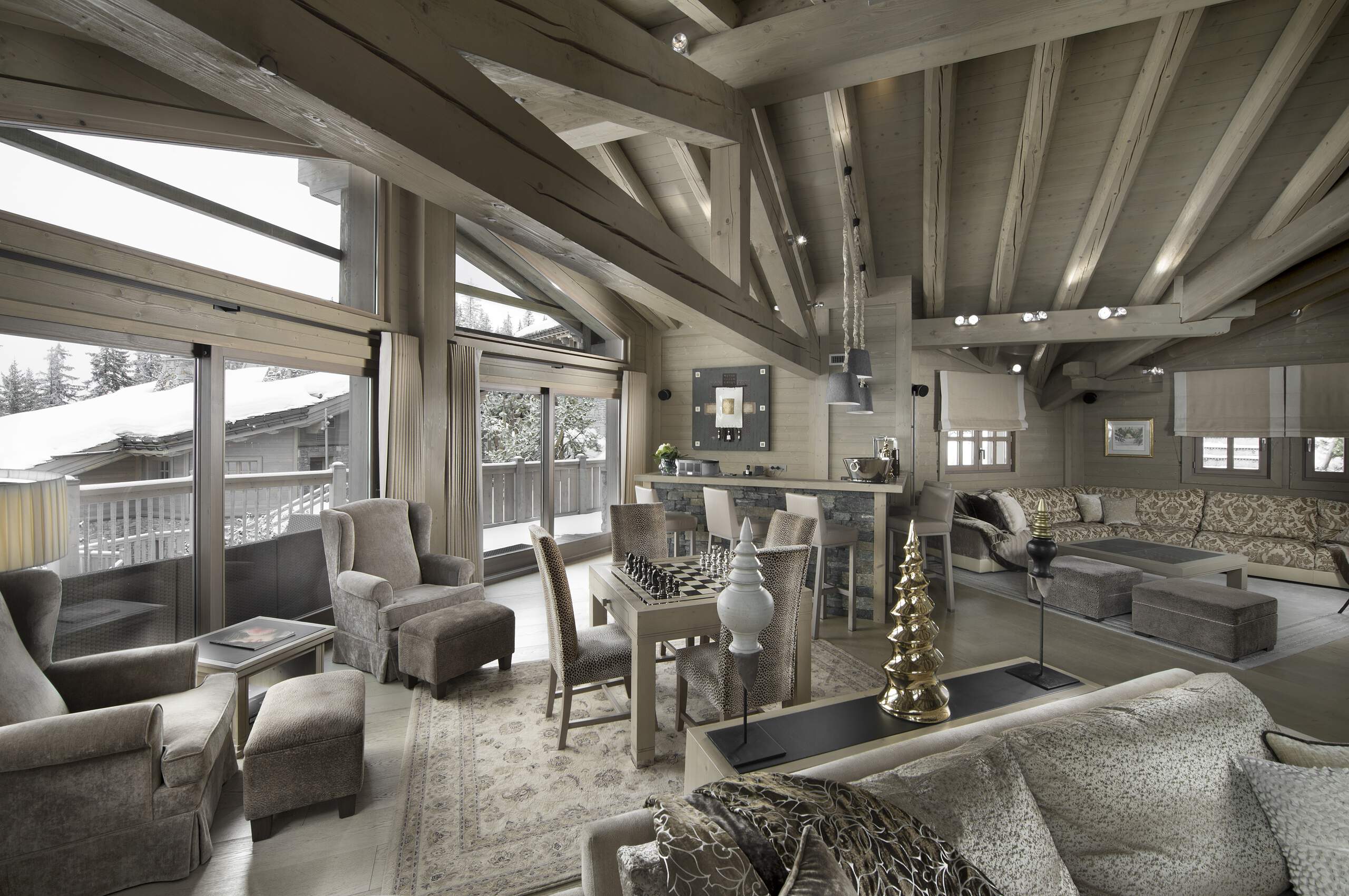 chalet-abbie-livingroom-gamesroom-bar-hosting-entertainment-balcony-mountainview-sleek-elegant-interior-design-luxury-rental-retreat-courchevel1850