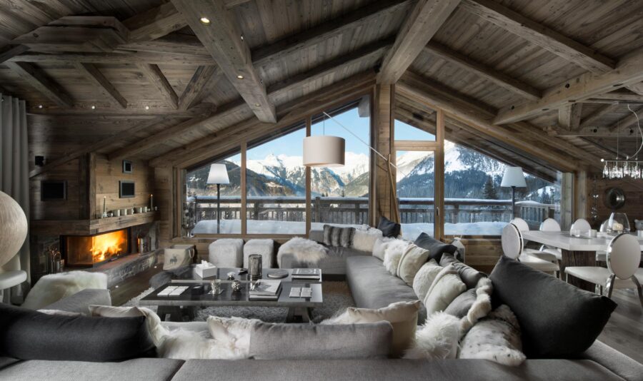 chalet-aure-mainpage-lounge-living-space-mountain-view-balcony-fireplace-grand-elegant-alpine-interiors-luxury-rental-courchevel1550