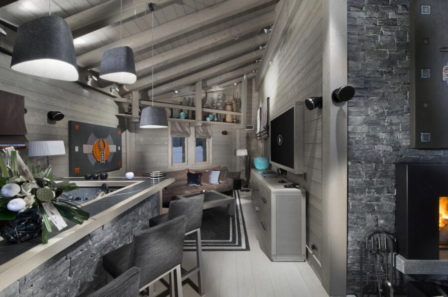 chalet-aurora-interior-livingarea-bar-tv-fireplace-cosy-sleek-modern-alpine-design-luxury-alist-courchevel