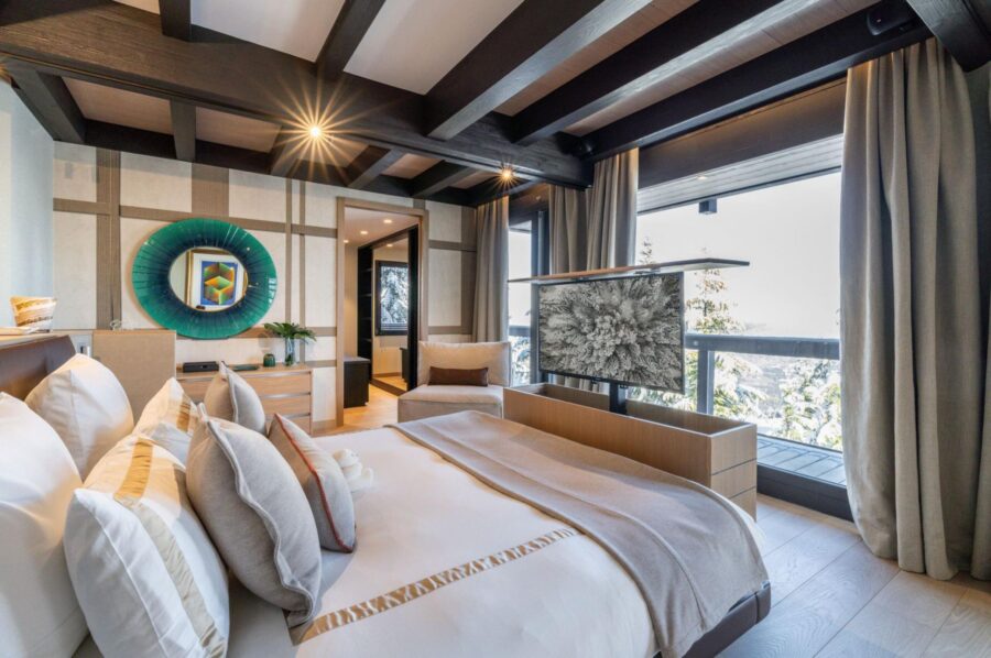 chalet-bleu-bedroom-tv-balcony-scenicviews-modern-alpine-design-luxury-rental-courchevel1850