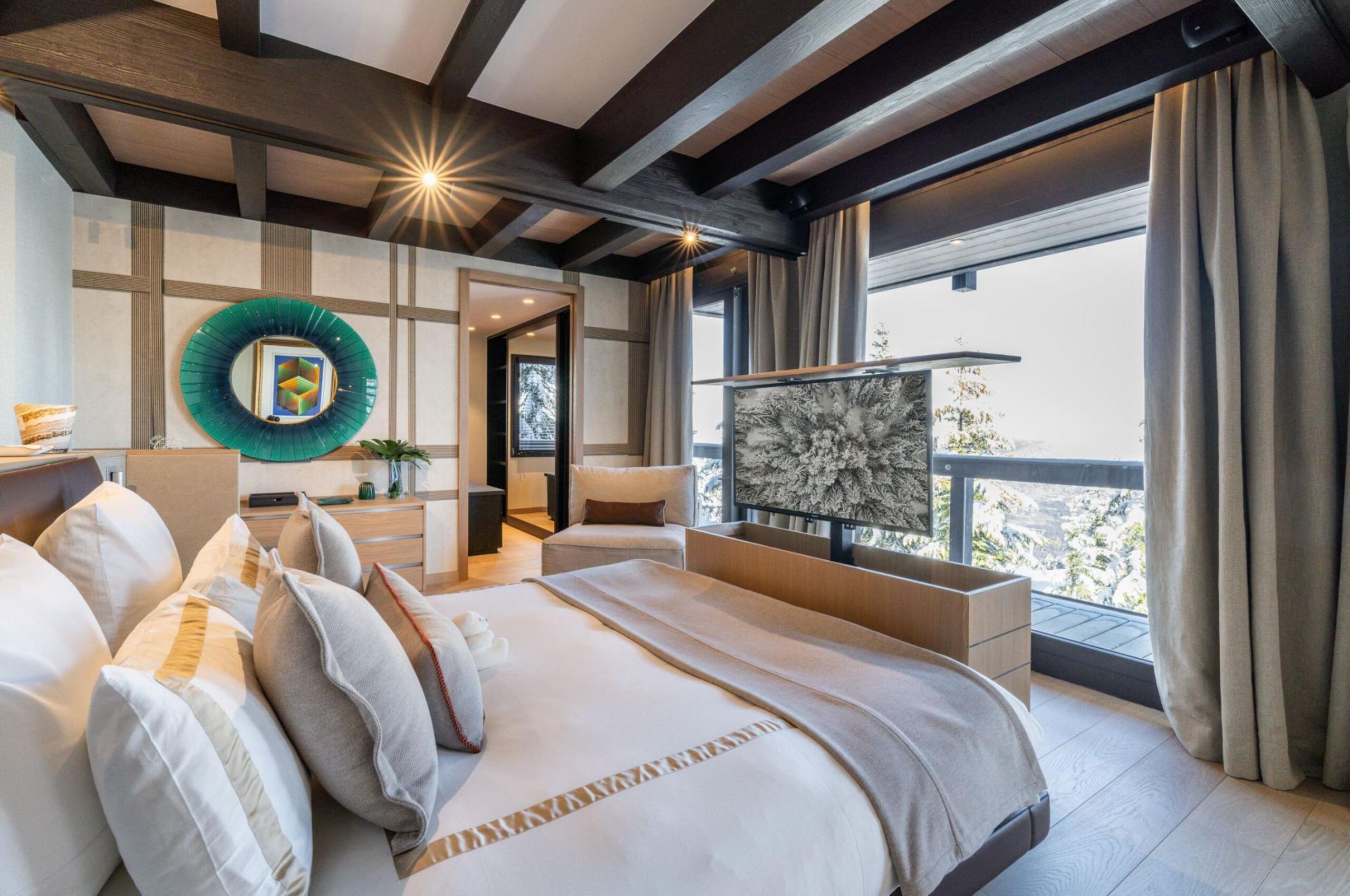 chalet-bleu-bedroom-tv-balcony-scenicviews-modern-alpine-design-luxury-rental-courchevel1850