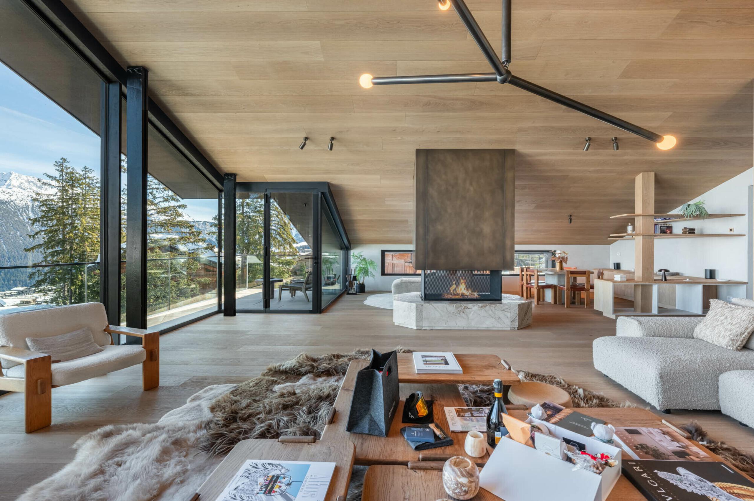 chalet-breeze-livingroom-openplan-fireplace-mountainviews-balcony-luxury-living-courchevel1850