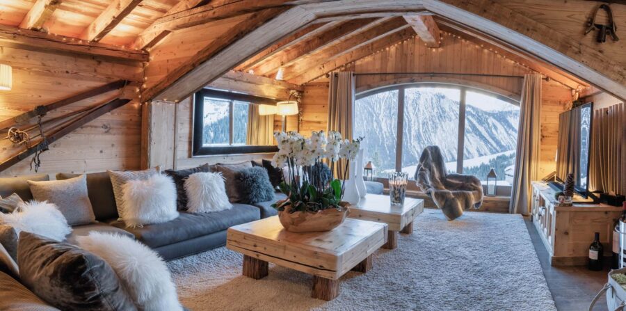 chalet-charlotte-mainpage-livingroom-stunning-mountain-views-elegant-modern-alpine-design-luxury-rental-retreat-courchevel1850