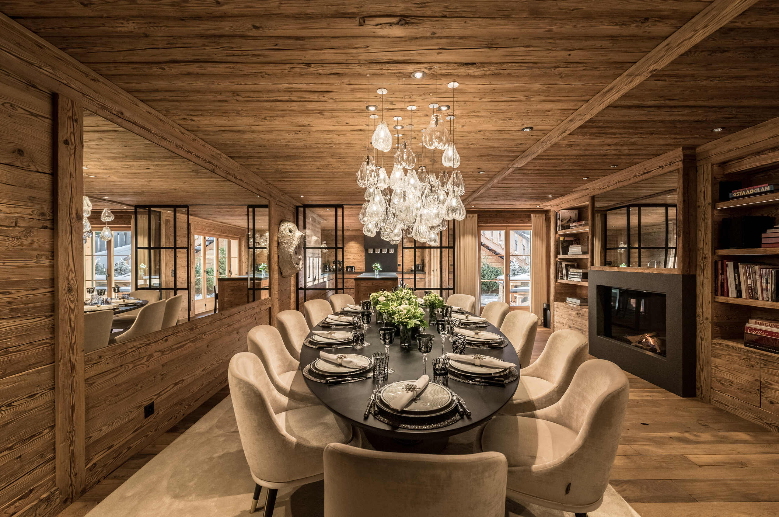 chalet-collette-diningroom-fireplace-library-luxury-modern-alpine-interior-gstaad