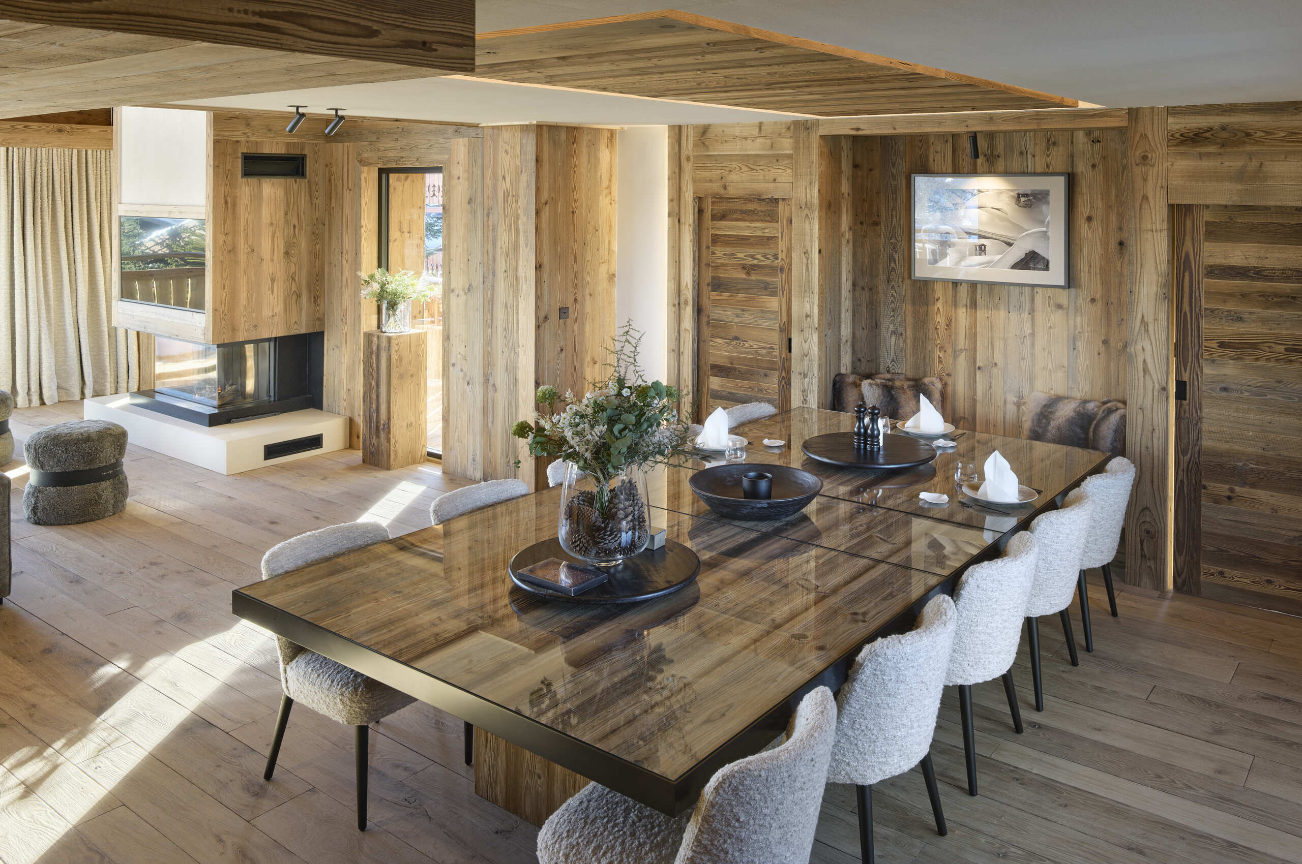 chalet-julia-diningroom-fireplace-openplan-luxury-alpine-interiordesign-courchevel1850