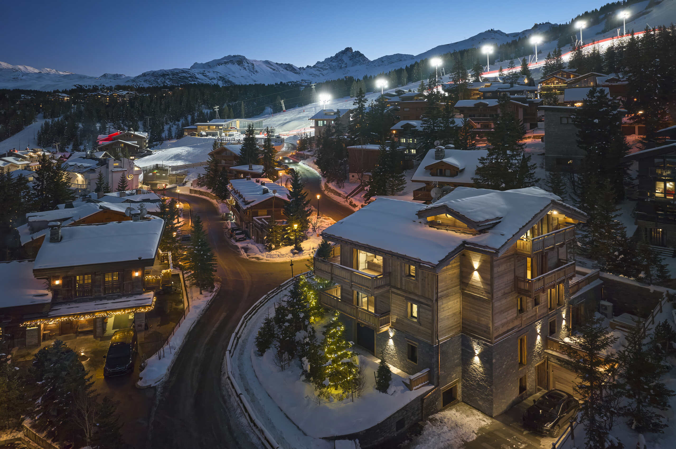 chalet-julia-exterior-aerial-night-luxury-rental-retreat-courchevel1850