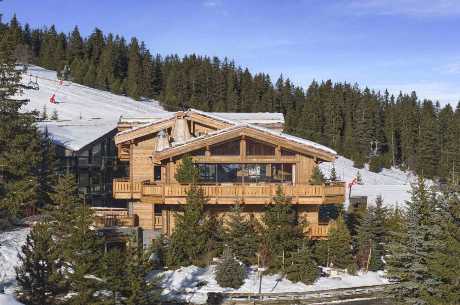 chalet-julia-exterior-daytime-ski-lift-slopes-alpine-luxury-rental-retreat-courchevel1850