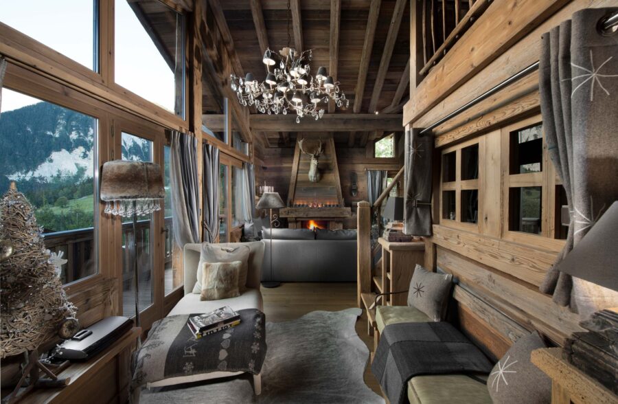 chalet-maya-living-room-balcony-fireplace-stunning-mountain-views-luxury-alpine-interior-courchevel1550