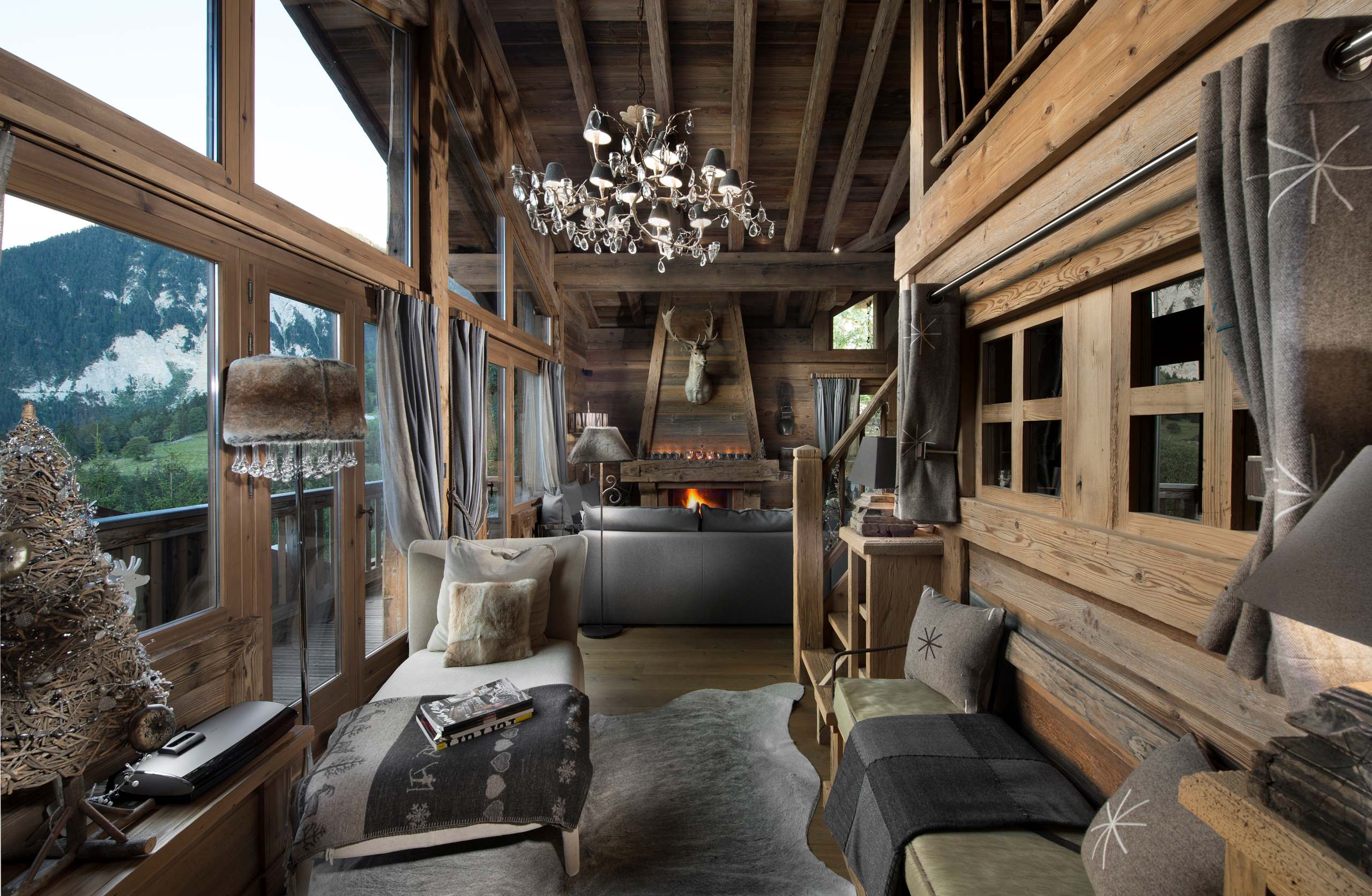 chalet-maya-living-room-balcony-fireplace-stunning-mountain-views-luxury-alpine-interior-courchevel1550