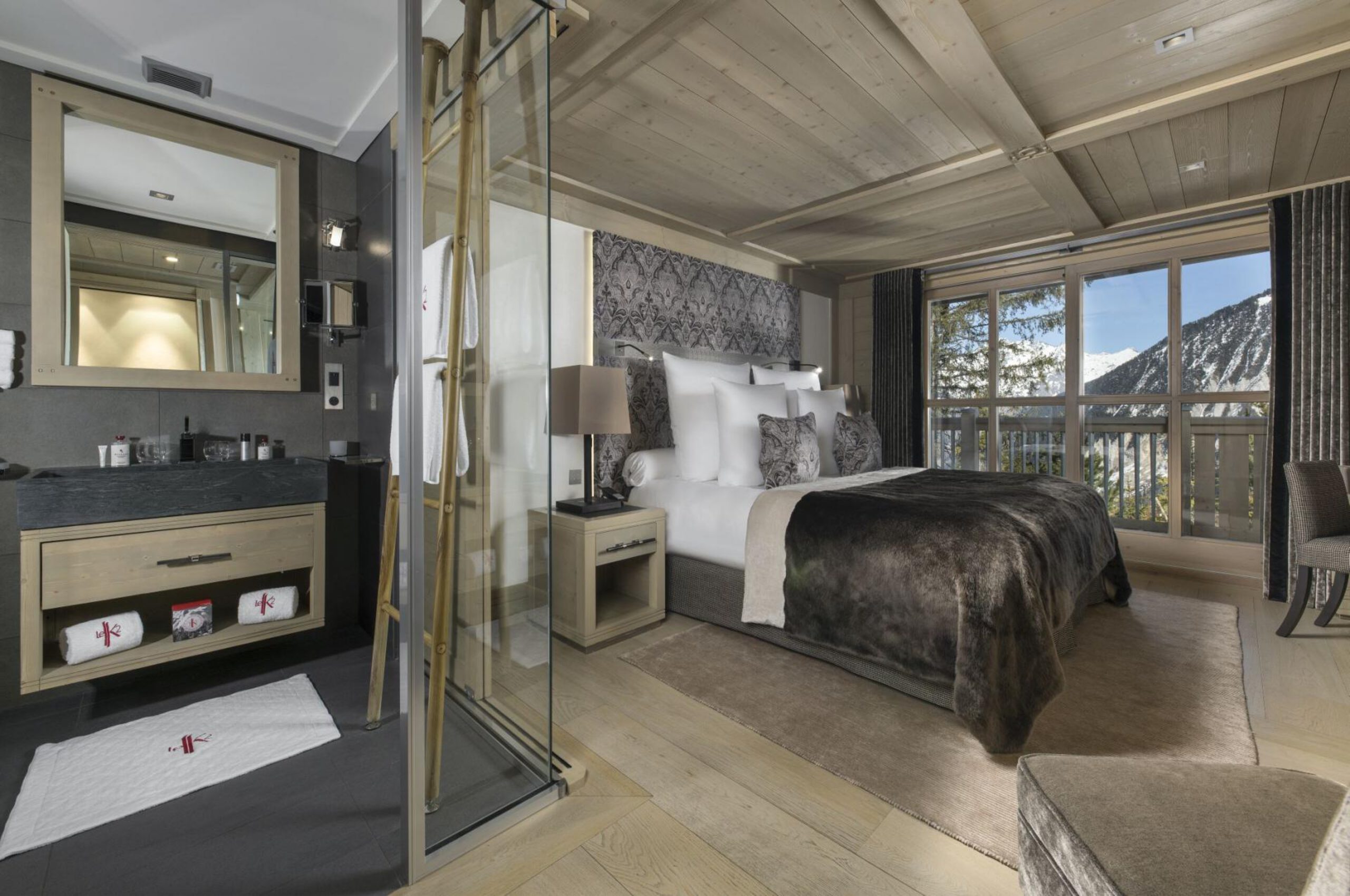 chalet-olympe-bedroom-mountainview-ensuite-bathroom-modern-sleek-alpine-design-luxury-interior-courchevel