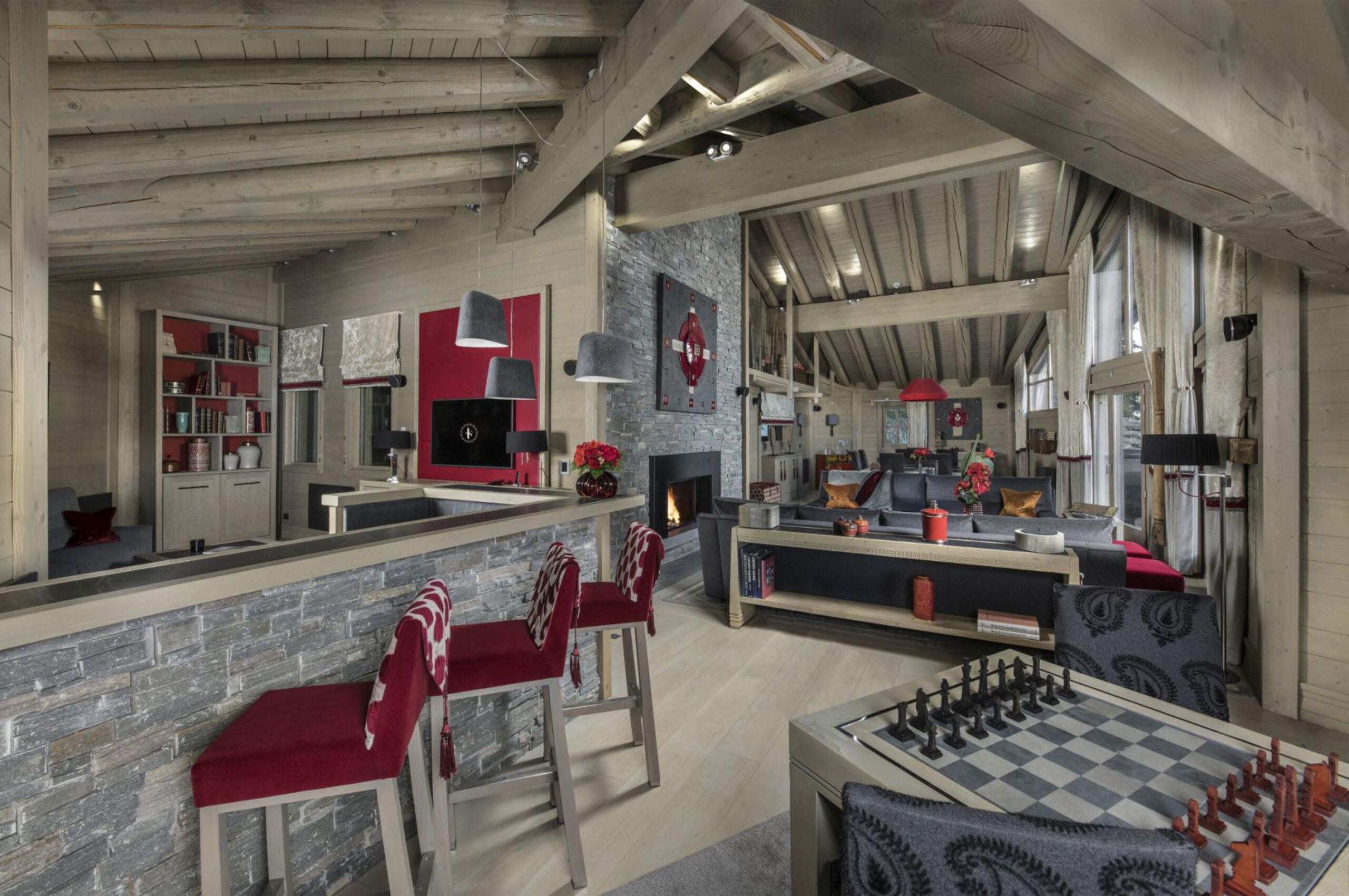 chalet-olympe-livingroom-bar-openplan-gamesroom-fireplace-luxury-interiordesign-courchevel