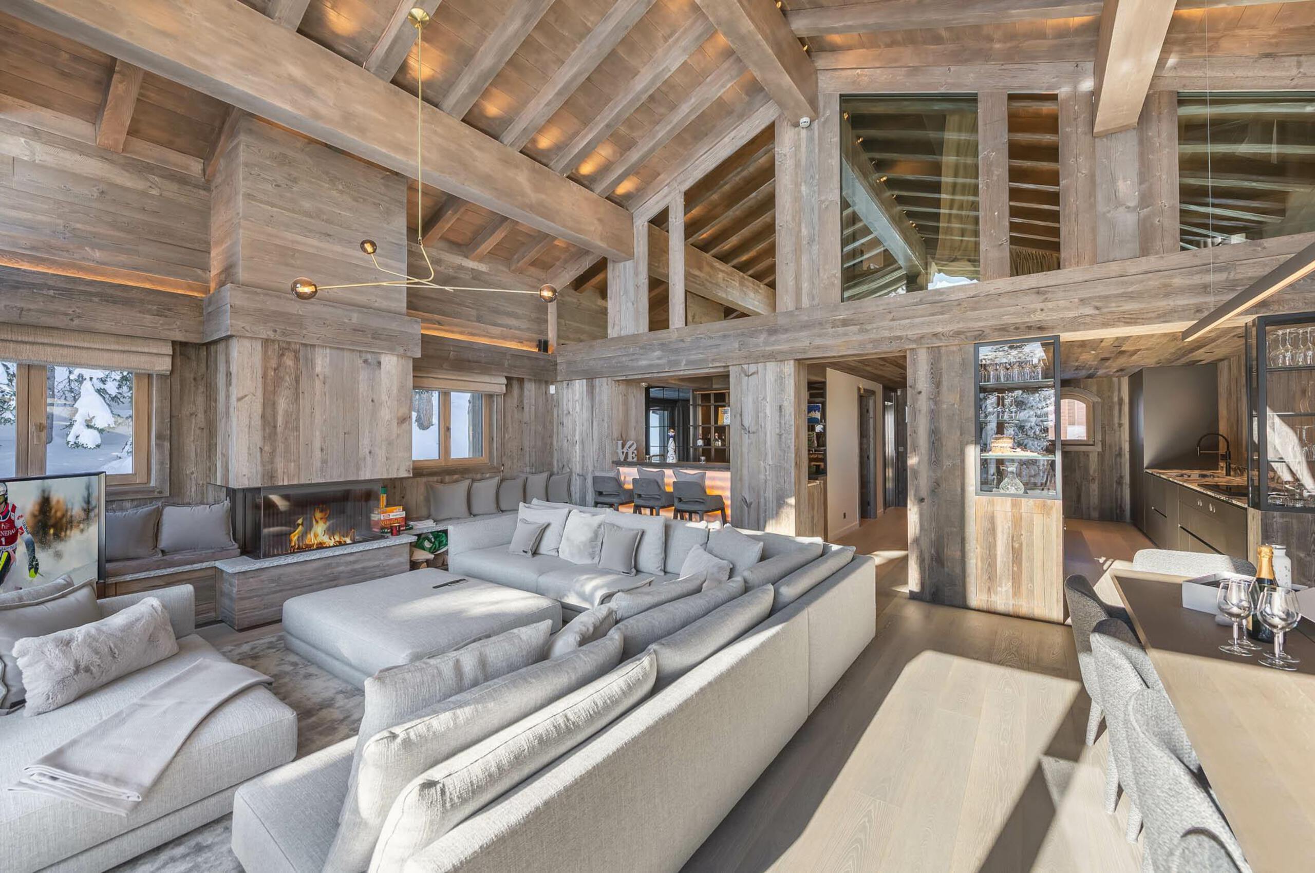 chalet-rosa-livingarea-openplan-fireplace-luxury-alpine-modern-design-courchevel1850