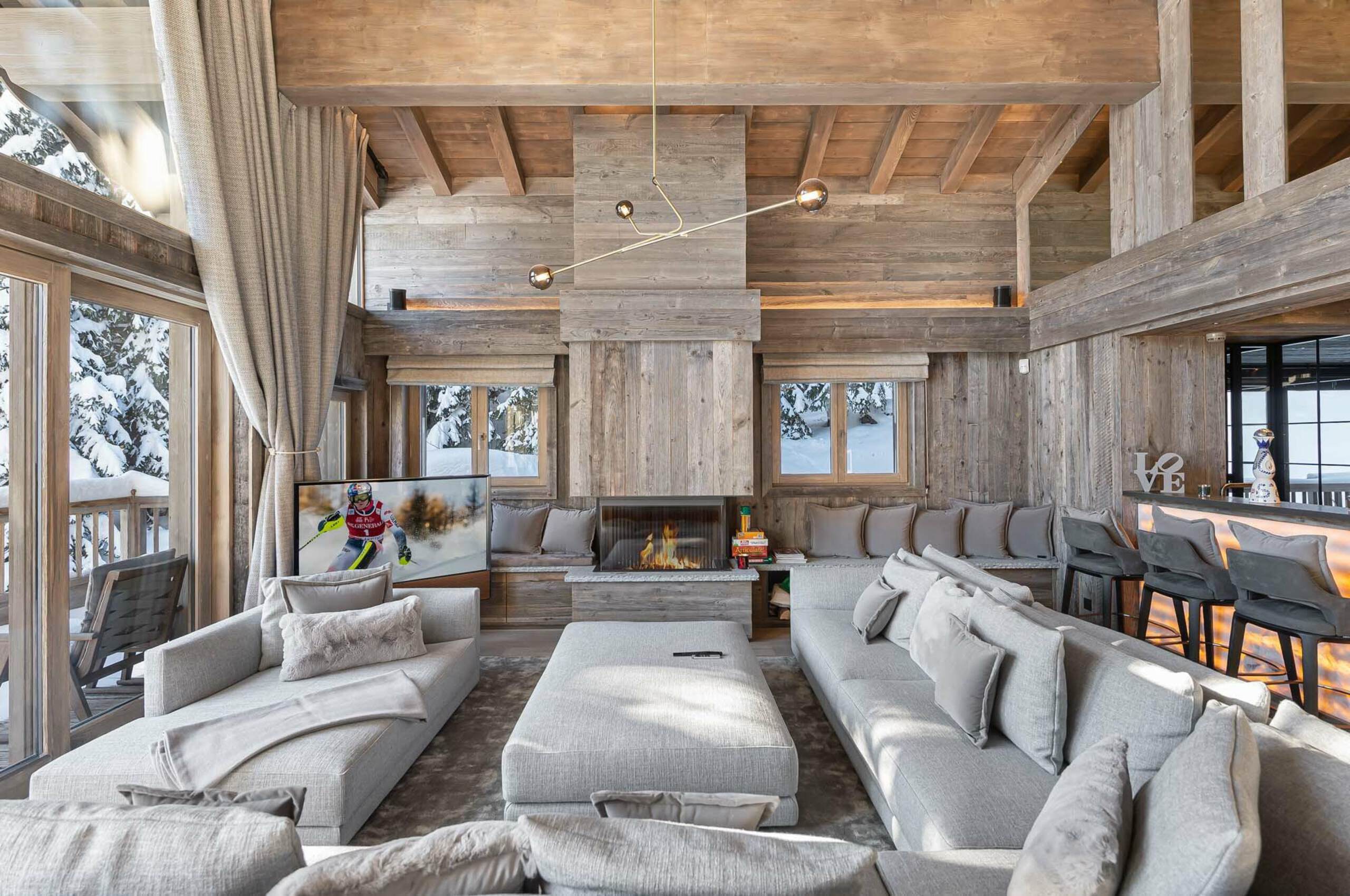 chalet-rosa-livingroom-fireplace-spacious-openplan-living-bar-modern-luxury-alpine-interiors-courchevel1850