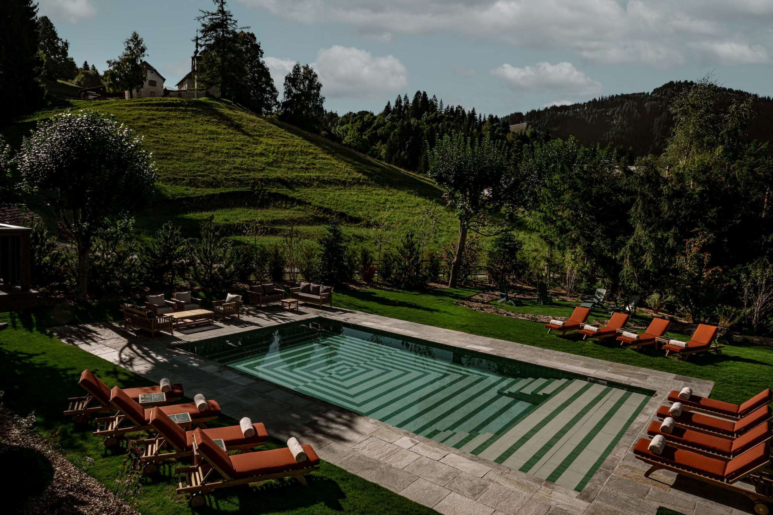 chalet-sabrina-outdoorpool-garden-sunbeds-scenic-views-summer-luxury-rental-retreat-megeve