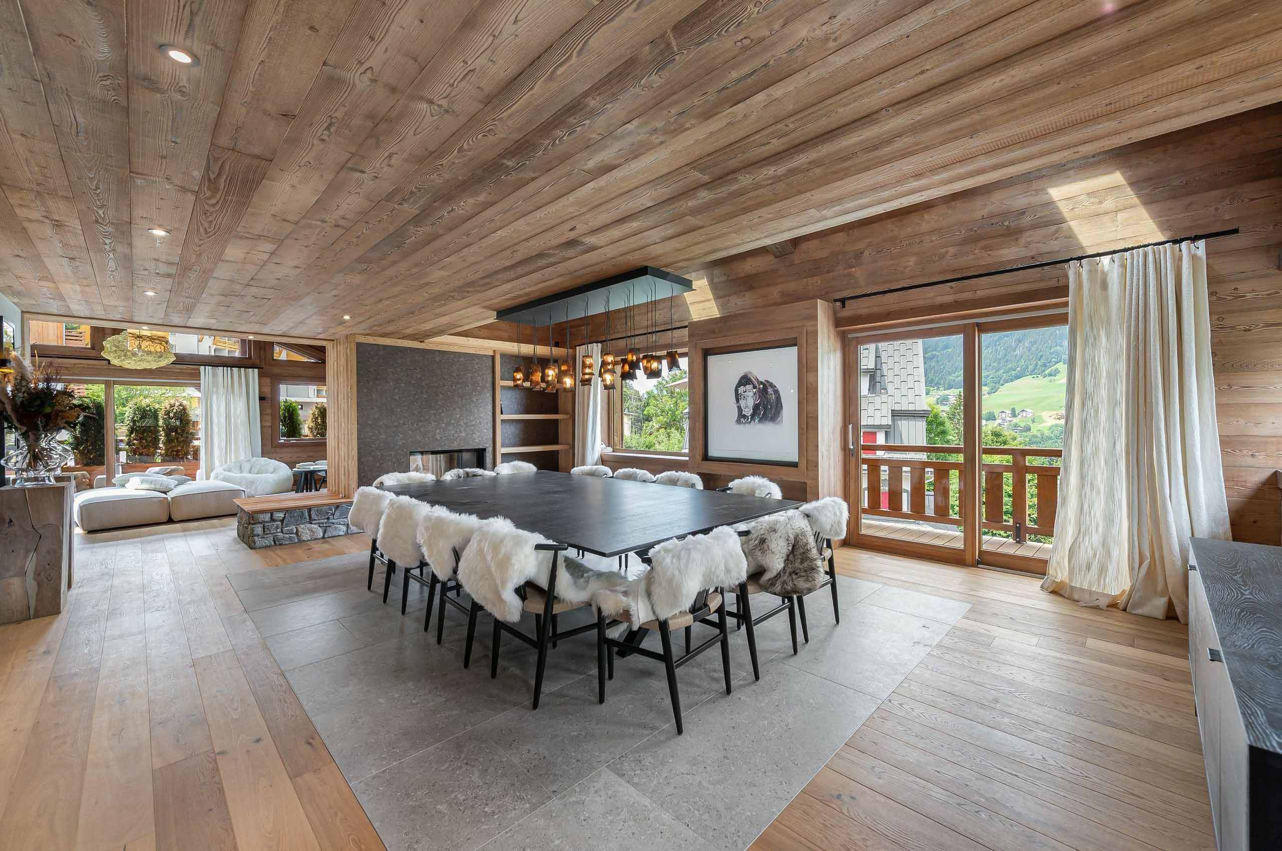 chalet-wynn-diningroom-openplan-scenicviews-fireplace-modern-alpine-luxury-megeve