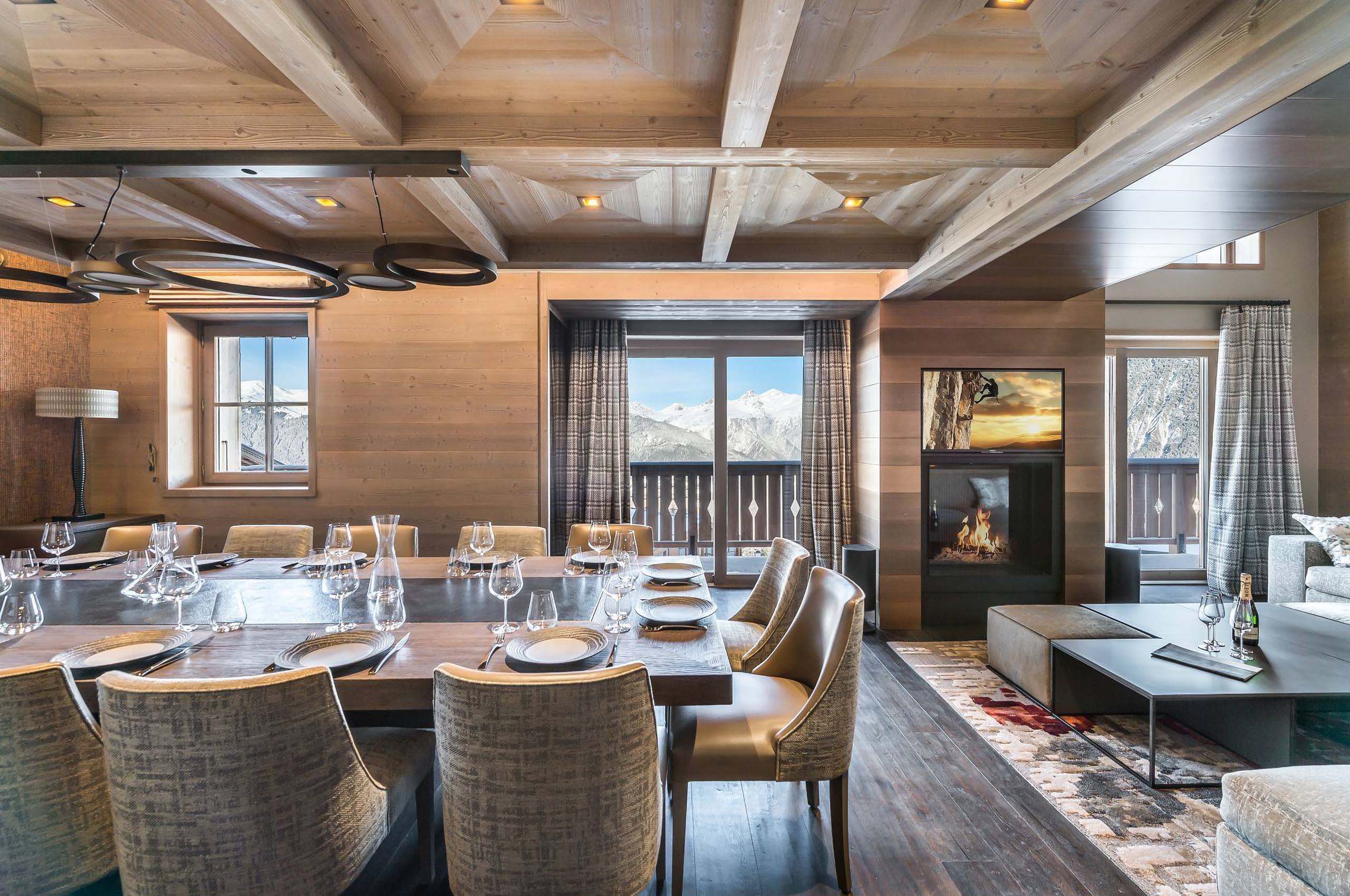 diningroom-mountainview-balcony-fireplace-interior-courchevel1850-luxury-chalet-alexi