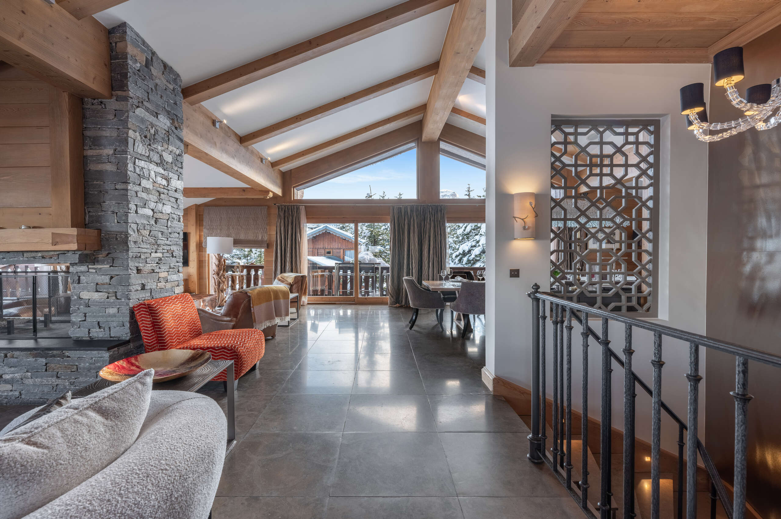 livingarea-openplan-fireplace-stunningviews-spacious-luxury-alpine-design-courchevel1850-chalet-blanche