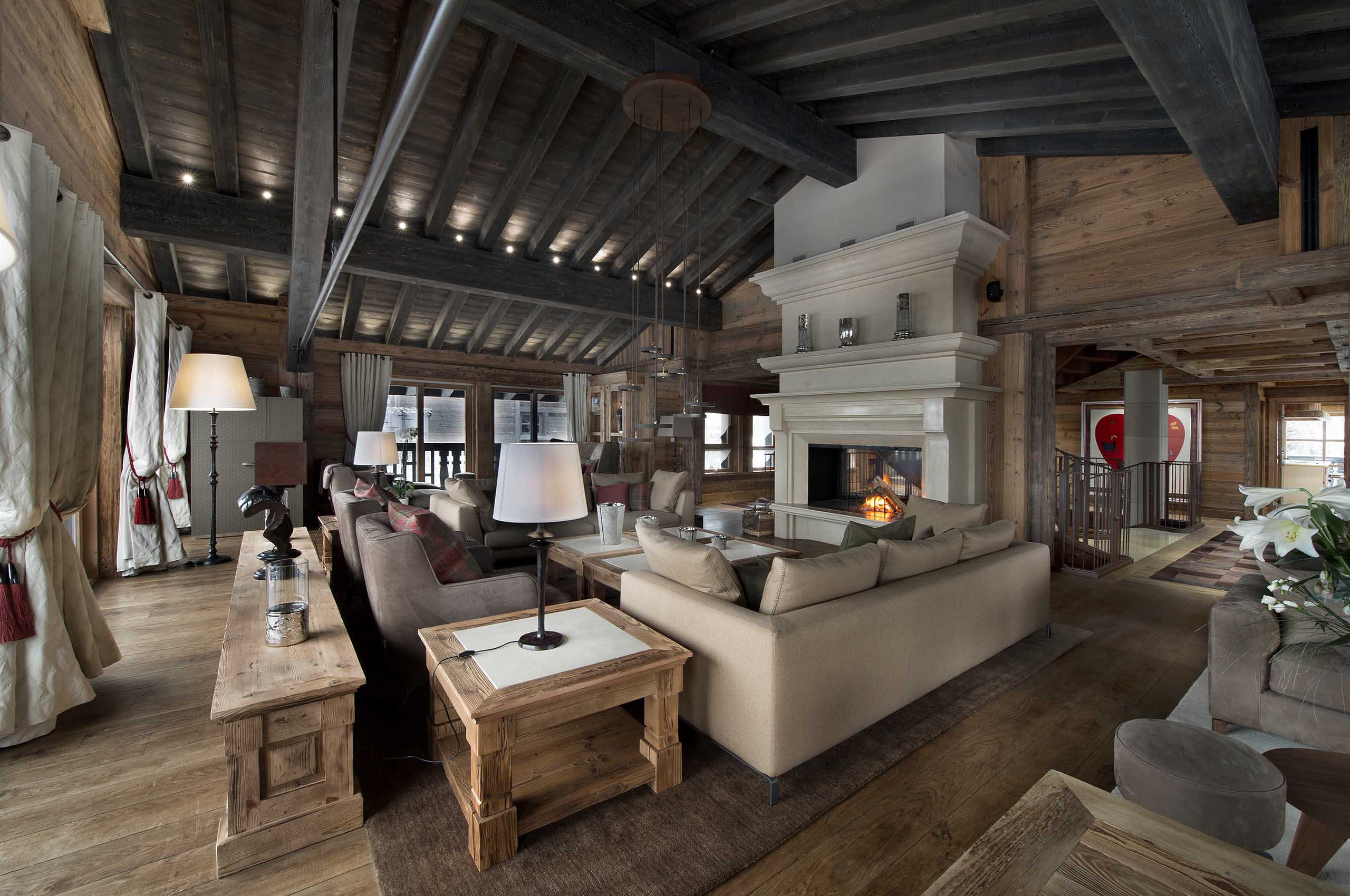 livingroom-fireplace-elegant-spacious-alpine-design-courchevel1850-luxury-chalet-edel