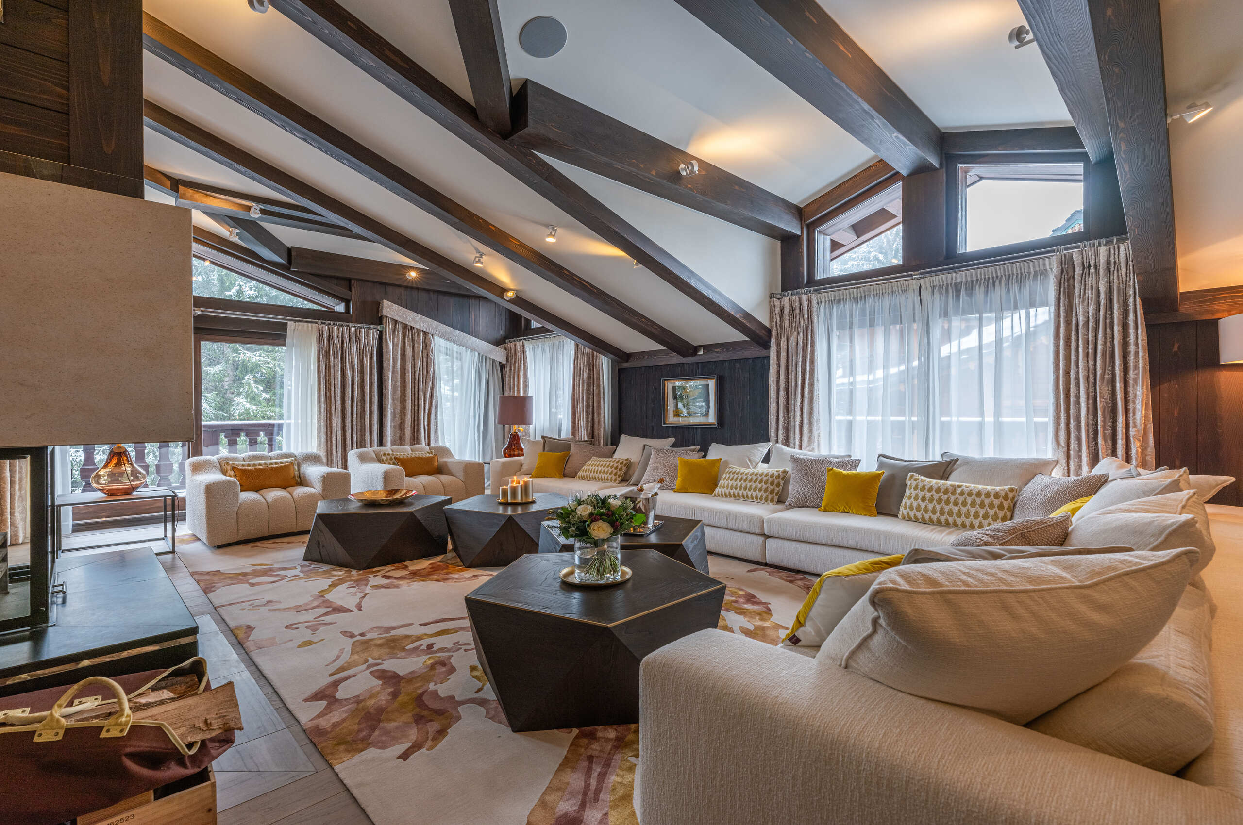 livingroom-lounge-spacious-elegant-stylish-interior-fireplace-balcony-luxury-retreat-courchevel1850-chalet-corinne
