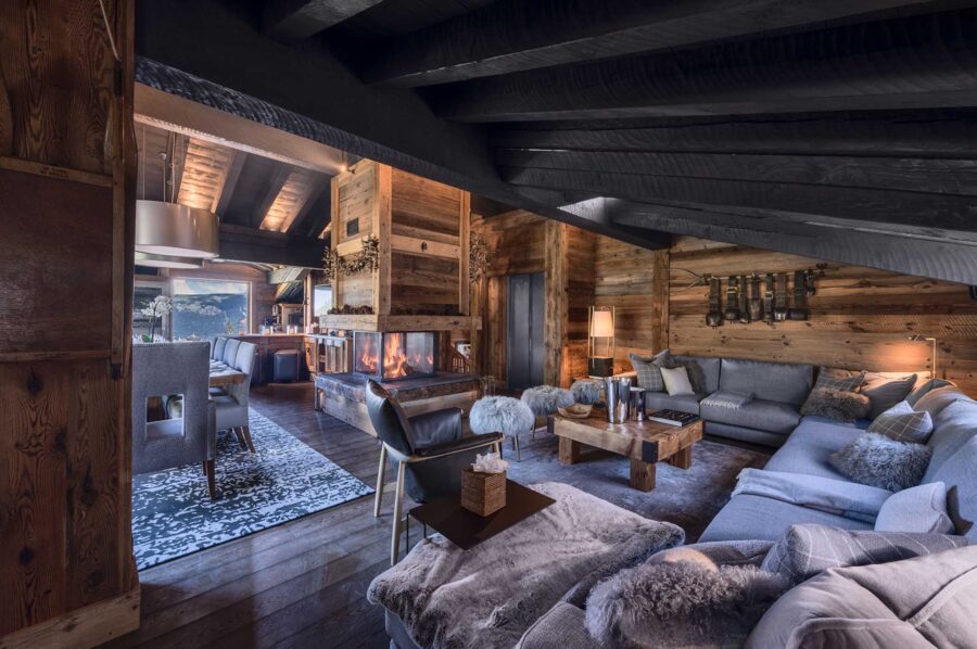livingspace-lounge-fireplace-openplan-mountainview-alpine-interior-courchevel1850-luxury-chalet-chateau