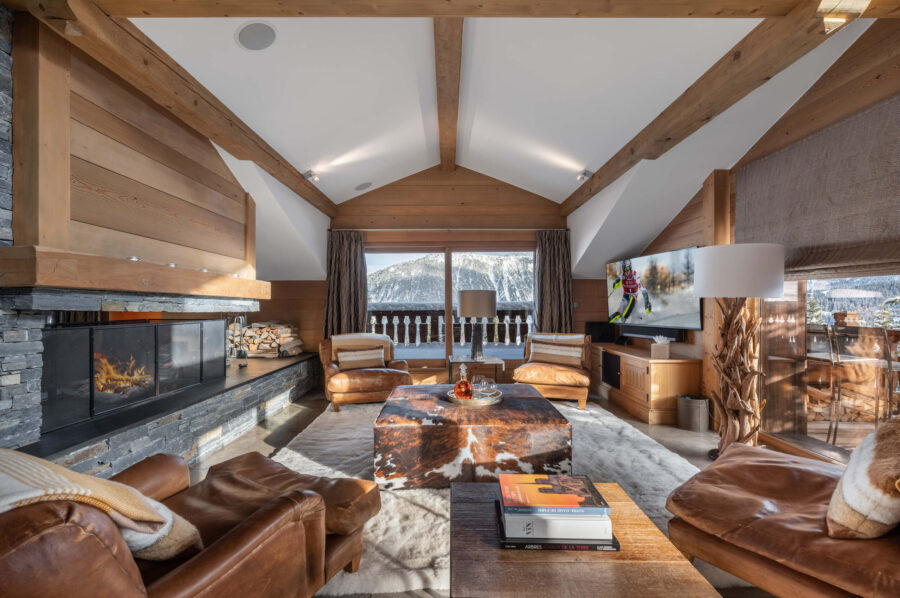 mainpage-livingroom-mountainview-fireplace-luxury-bespoke-interiordesign-courchevel1850-chalet-blanche