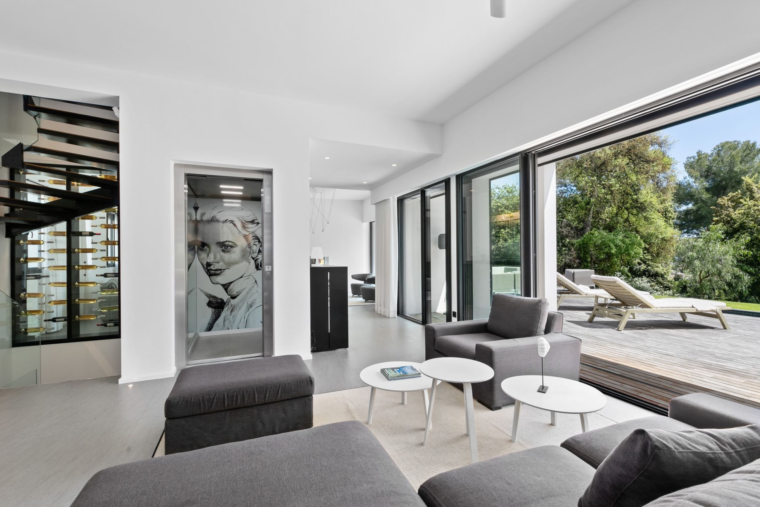 villa-chantal-livingroom-openplan-spacious-modern-artwork-lift-terrace-access-luxury-interiordesign-antibes