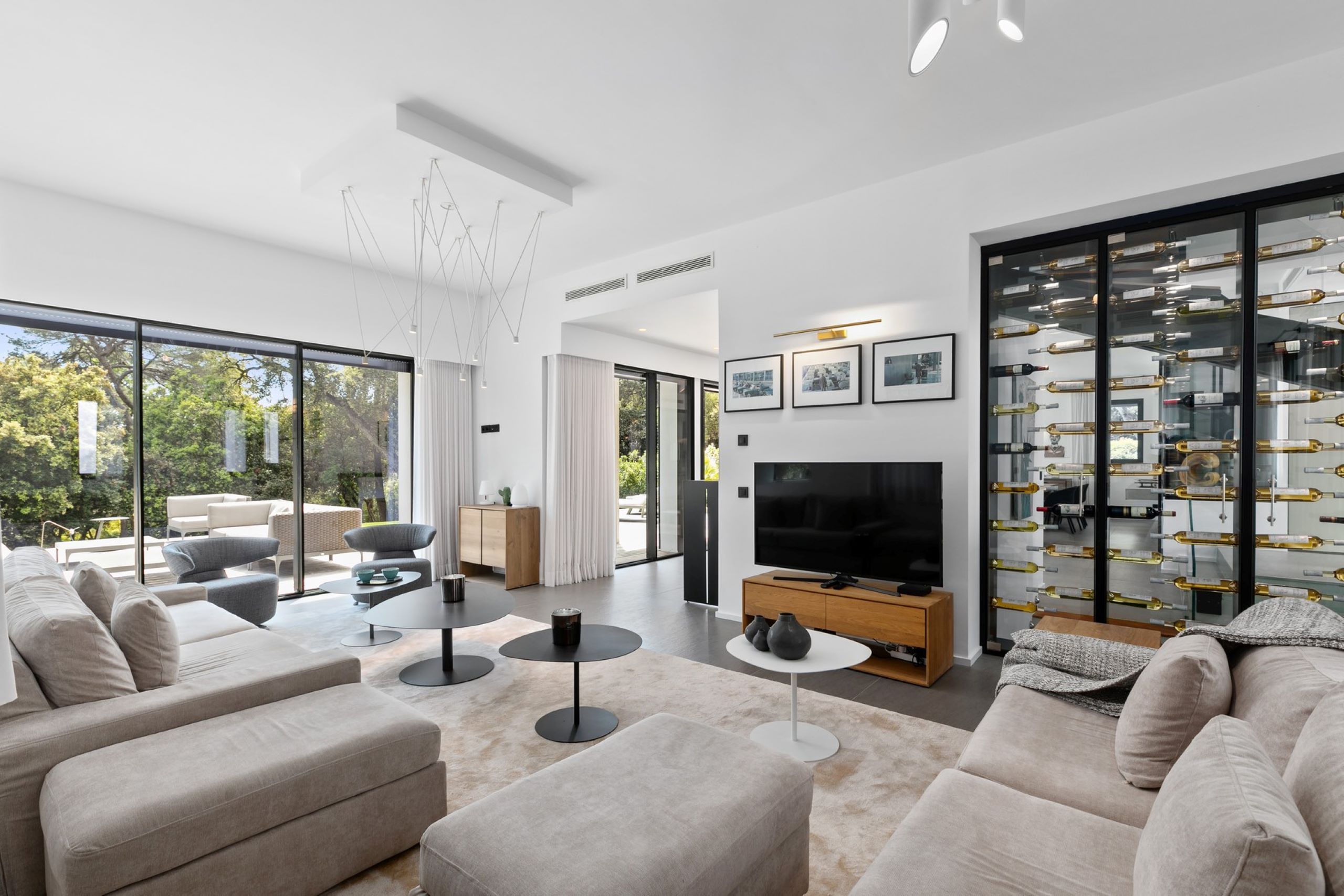 villa-chantal-livingroom-wine-display-modern-sleek-bright-openplan-spacious-luxury-interiordesign-antibes