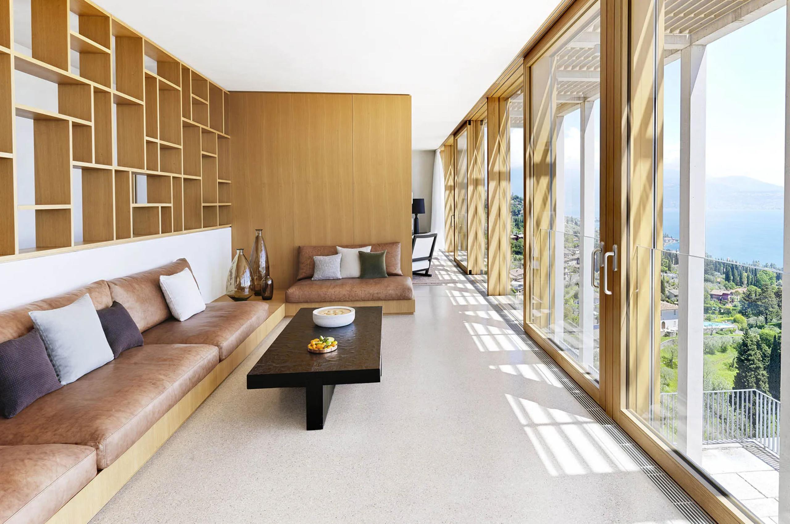 villa-karina-living-area-scenic-lake-views-sleek-modern-interior-design-luxury-lakegarda