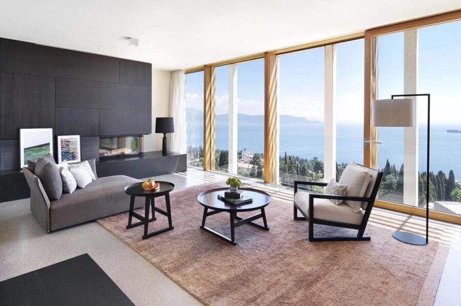 villa-karina-living-room-fireplace-scenic-lake-views-sleek-modern-design-luxury-lakegarda