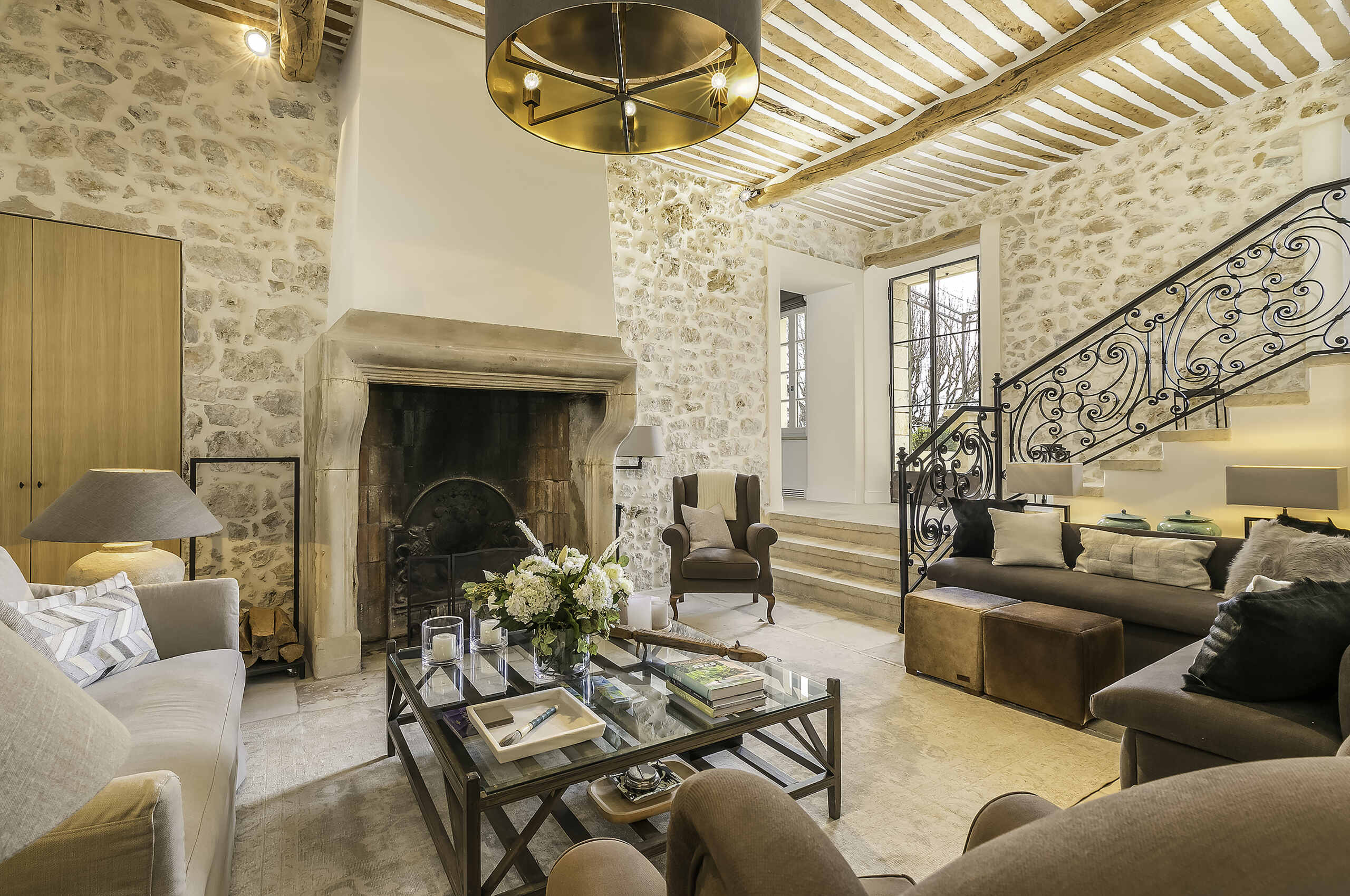 villa-mayan-livingroom-staircase-timeless-charm-fireplace-mougins