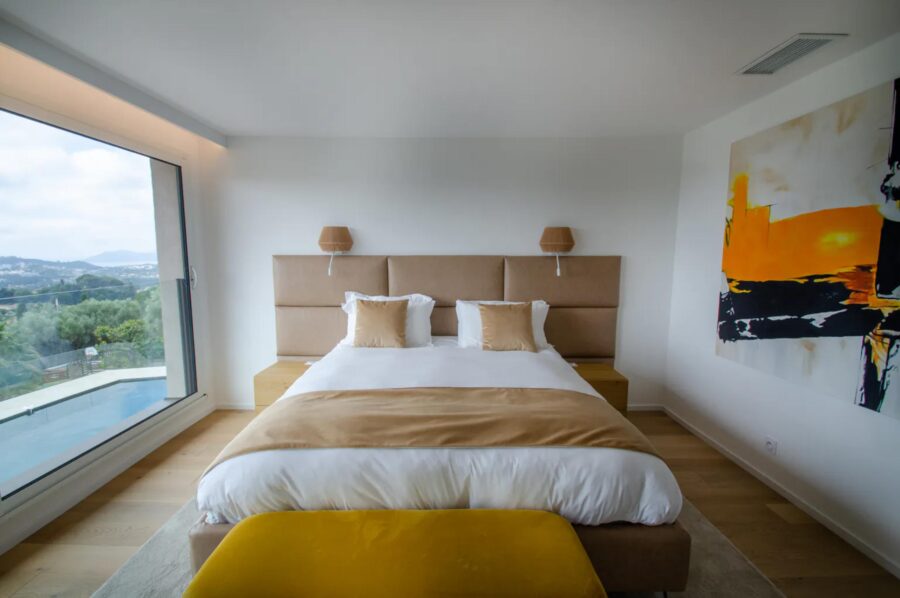 villa-mirelle-bedroom-pool-view-artwork-luxury-mougins
