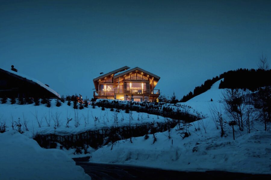 Chalel-Sybil-exterior-snowy-night-remote-luxury-rental-mont-darbois-megeve