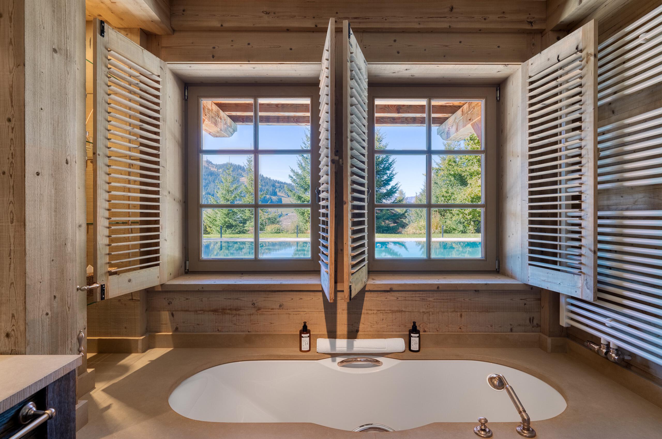 Chalet-Izabelle-bathroom-bathtub-mountainview-poolview-luxury-alpine-chic-megeve