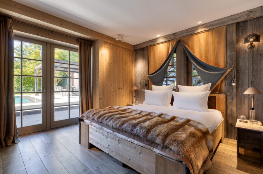 Chalet-Izabelle-bedroom-poolview-stylish-alpine-interior-luxury-retreat-megeve