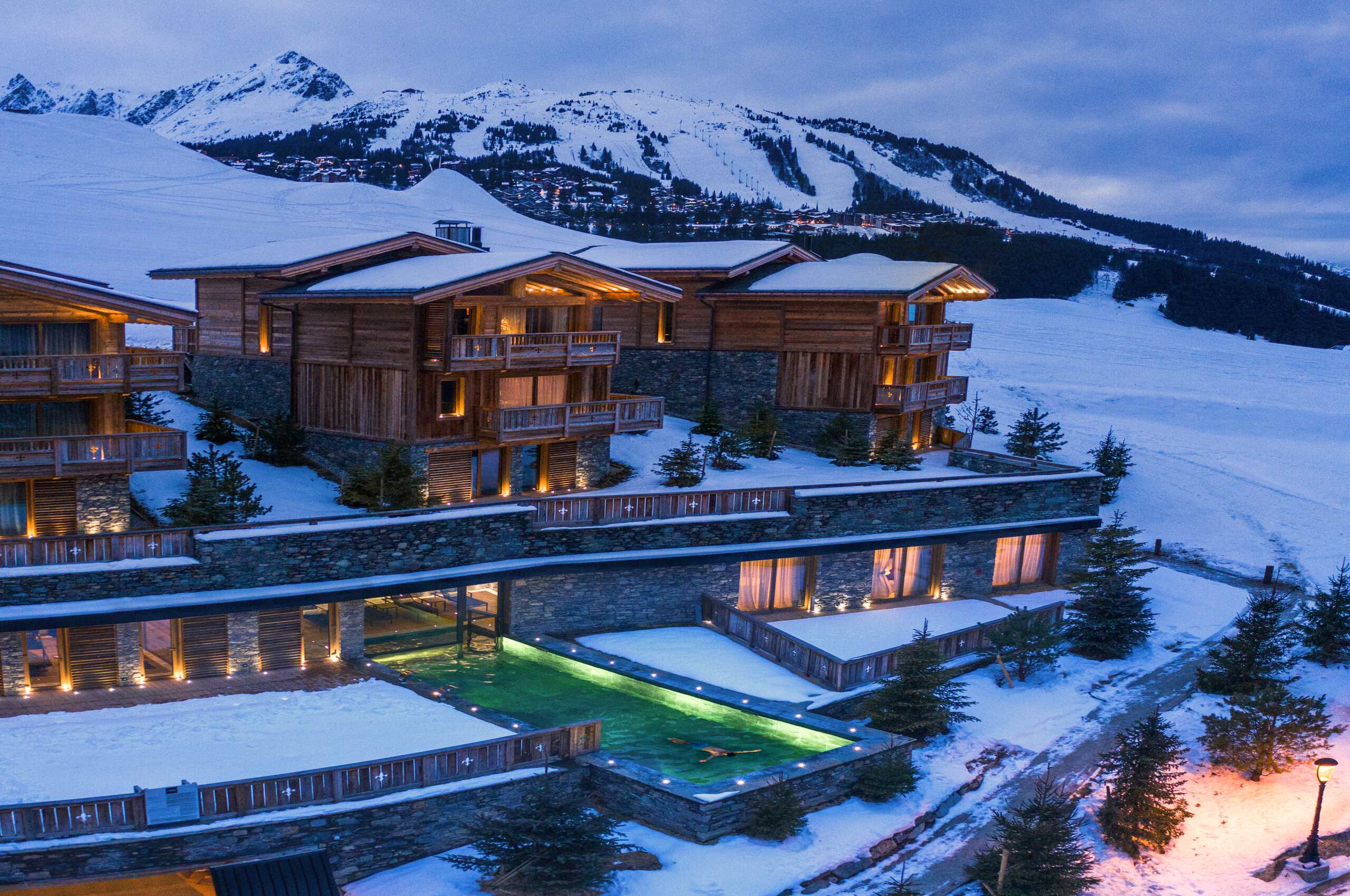chalet-avery-exterior-night-outdoorpool-mountainviews-winter-snow-luxury-rental-property-courchevel1650