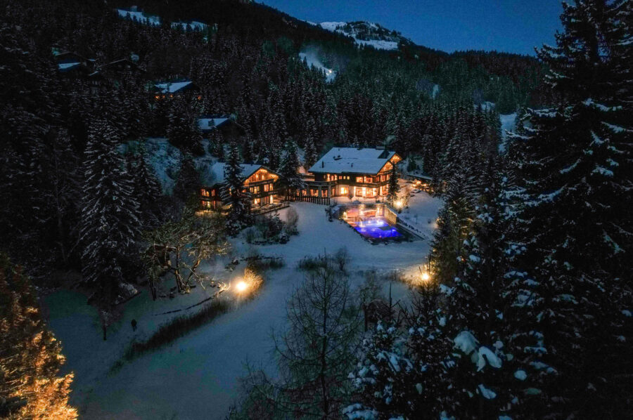 chalet-criselda-exterior-night-cosy-luxury-retreat-snowy-escape-crans-montana