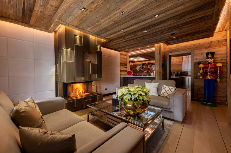 chalet-criselda-livingroom-fireplace-cosy-elegant-alpine-design-luxury-retreat-crans-montana