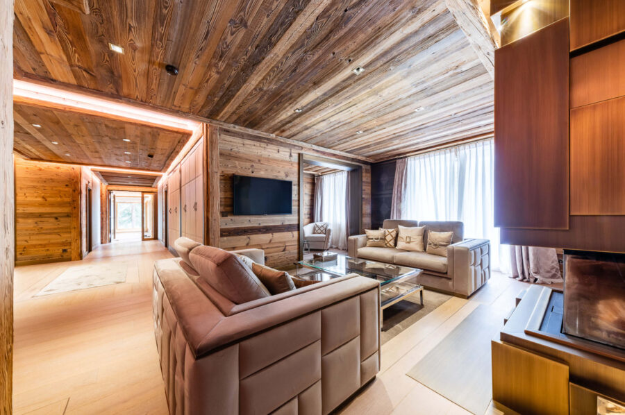 chalet-criselda-livingroom-fireplace-spacious-openplan-modern-alpine-design-luxury-rental-crans-montana