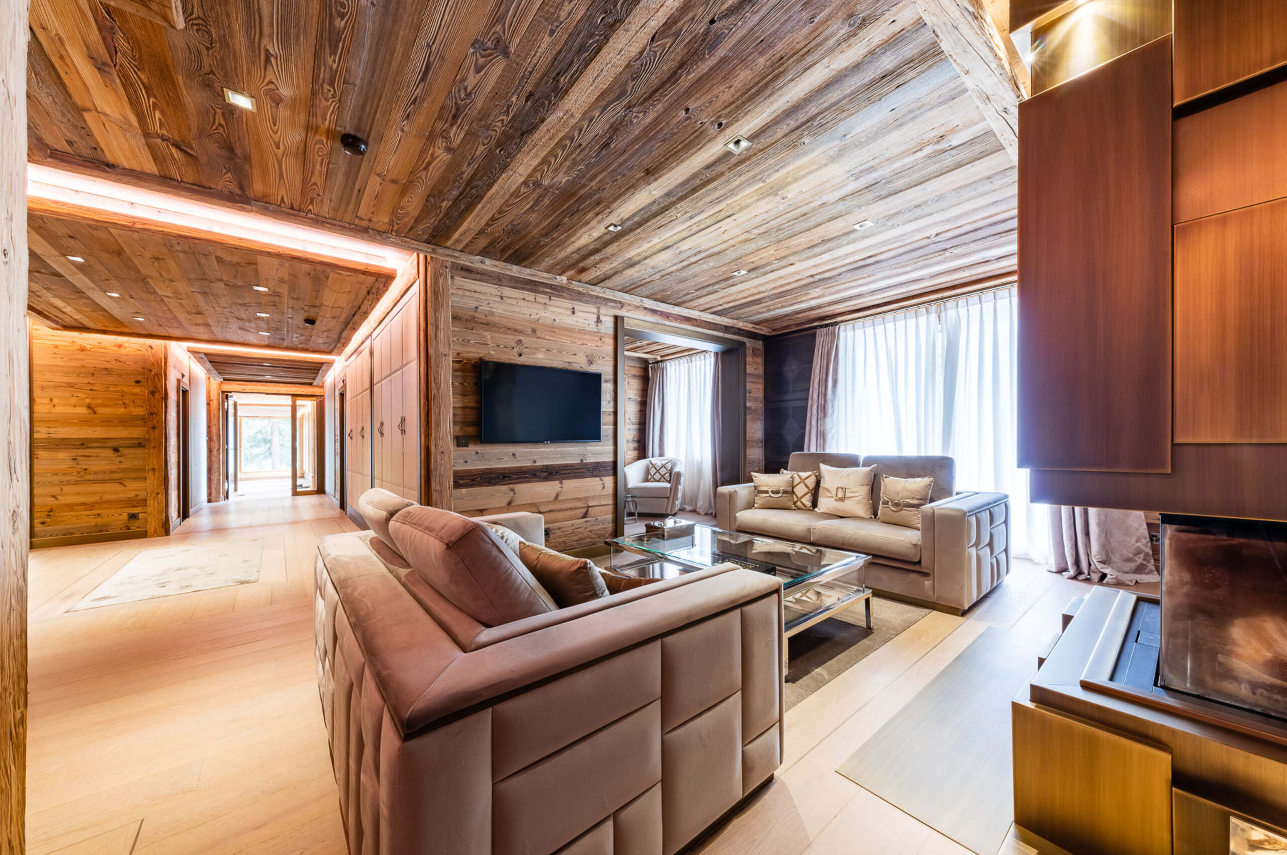chalet-criselda-livingroom-fireplace-spacious-openplan-modern-alpine-design-luxury-rental-crans-montana