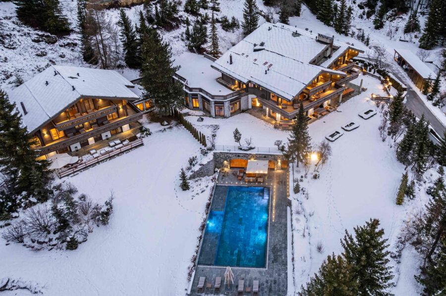chalet-croia-exeterior-aerial-adjoining-properties-pool-spa-luxury-rental-retreat-crans-montana
