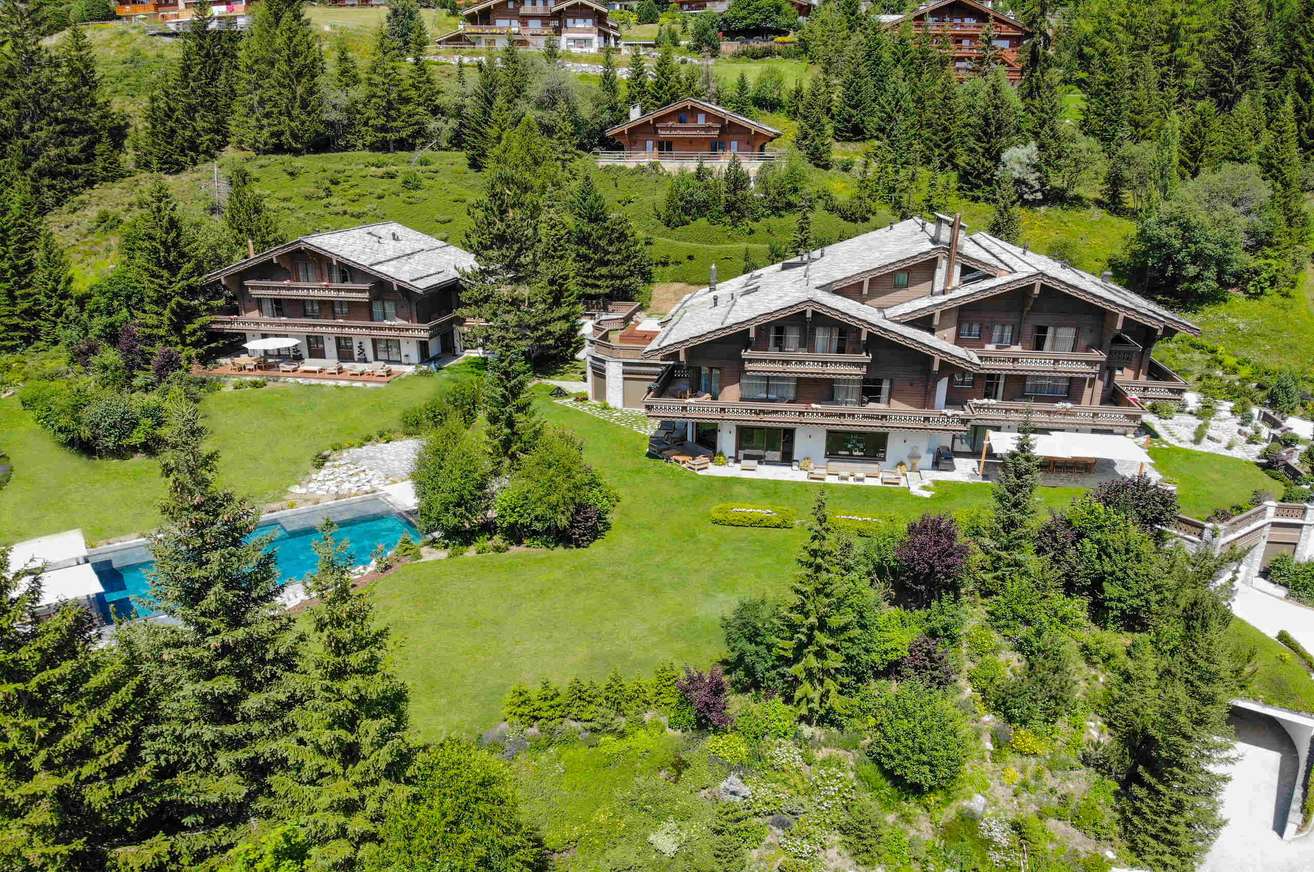 chalet-croia-exterior-adjoining-chalets-pool-spa-luxury-rental-retreat-crans-montana