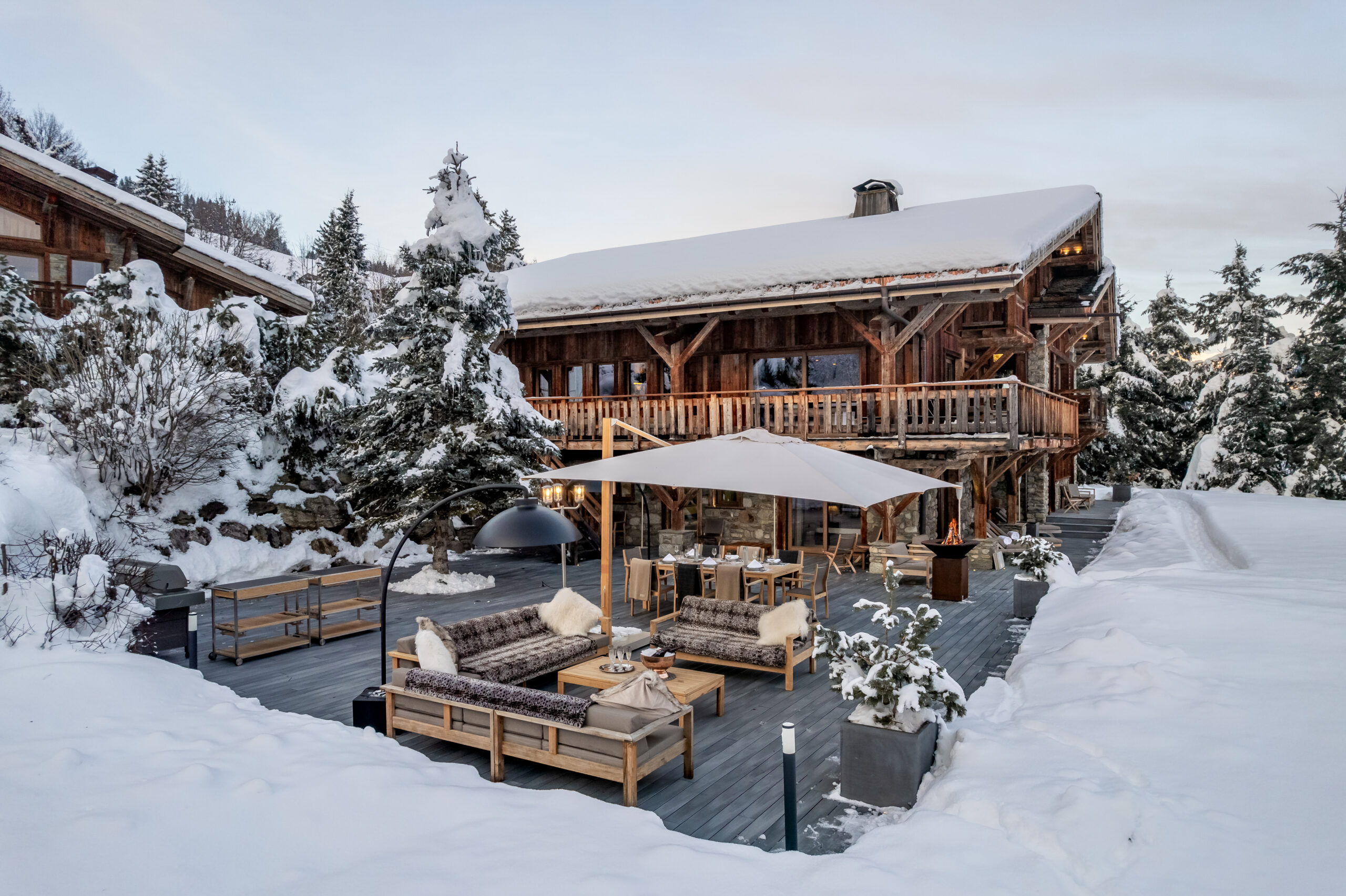chalet-deuce-exterior-winter-snow-outdoor-lounge-heaters-cosy-christmas-luxury-rental-property-megeve