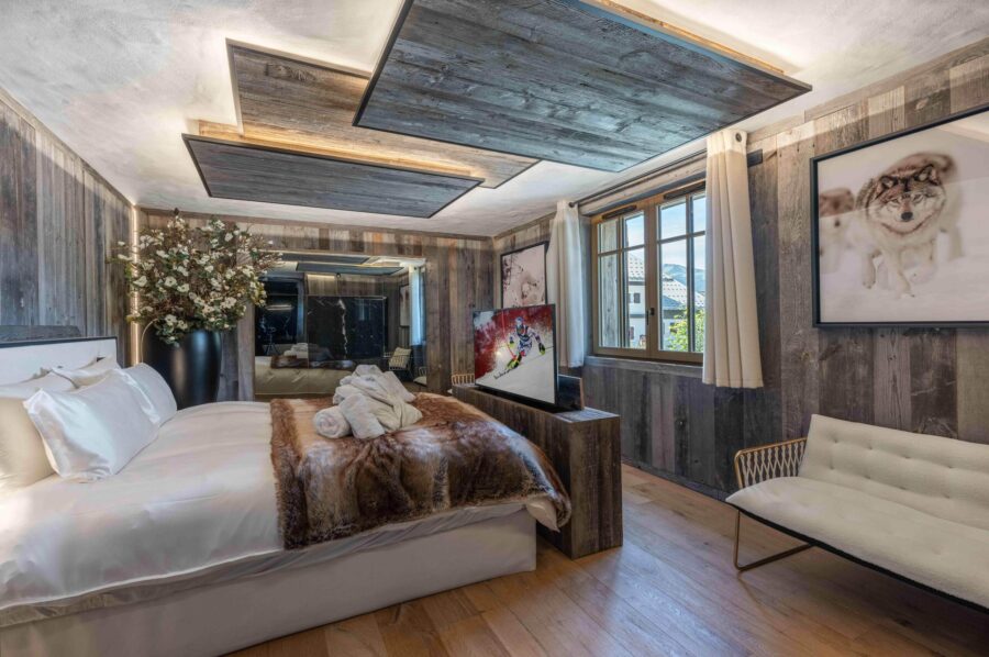 chalet-leia-bedroom-spacious-modern-tv-artwork-luxury-alpine-chic-design-megeve
