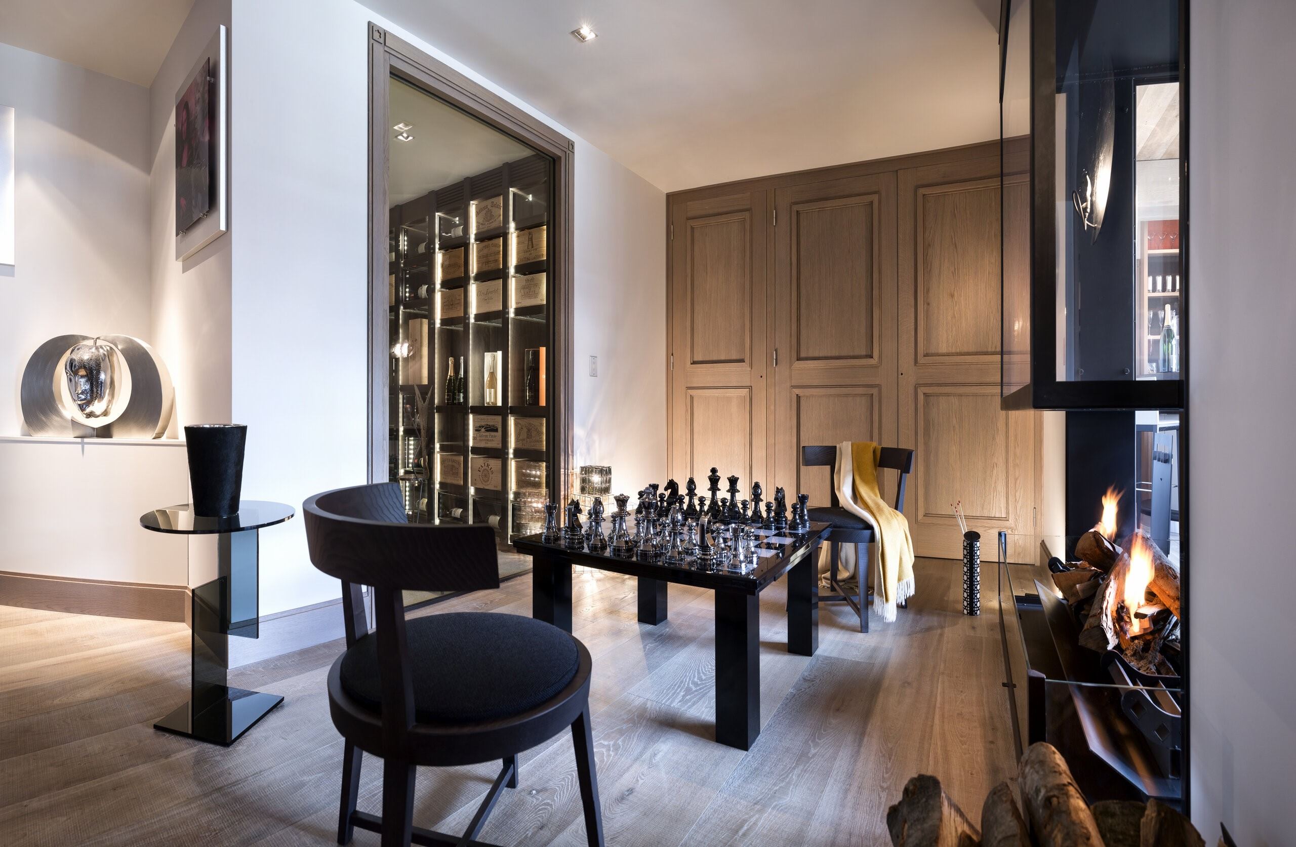 chalet-marianne-games-room-chess-fireplace-relaxation-entertainment-luxury-alpine-retreat-megeve
