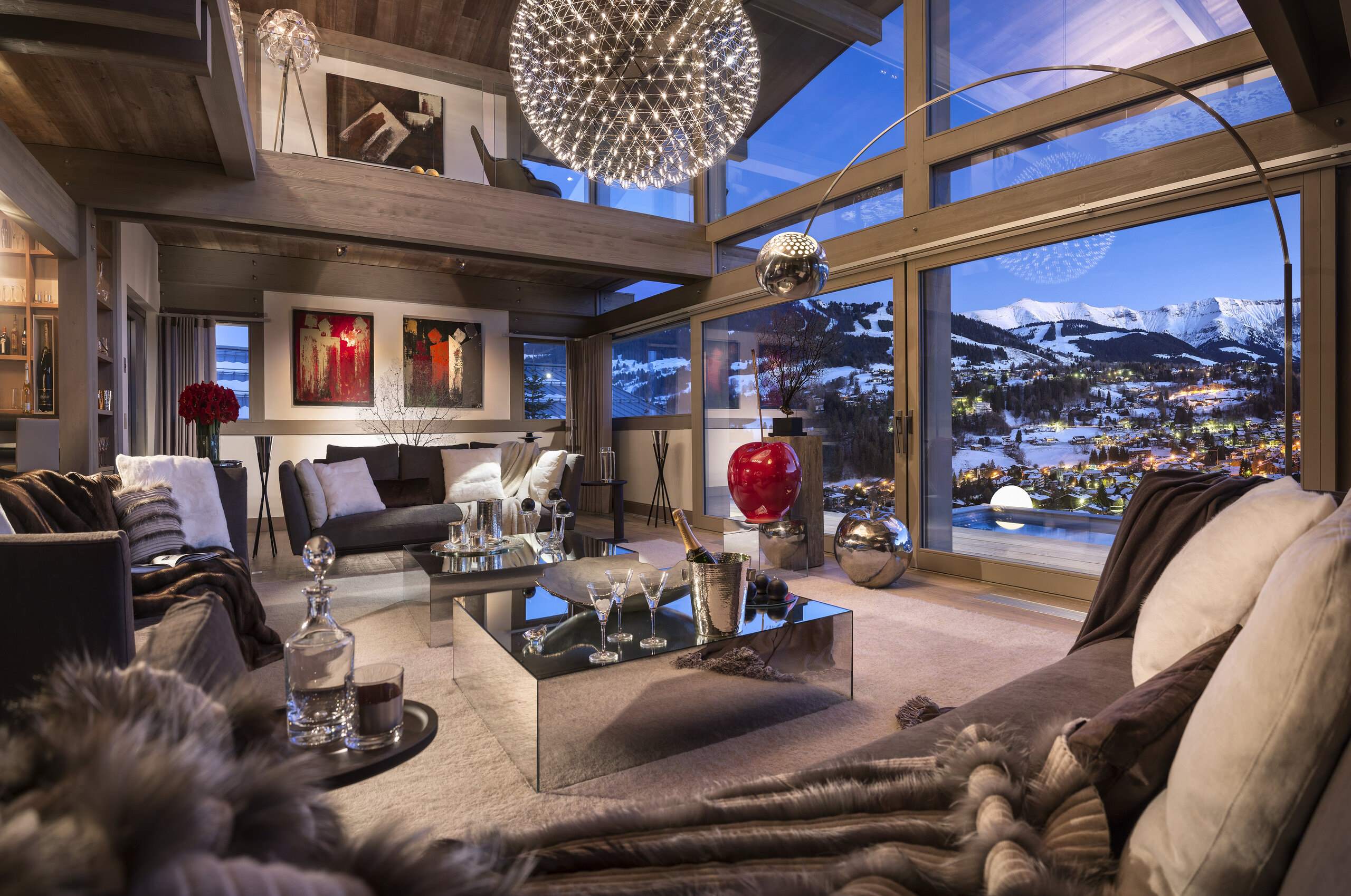 chalet-marianne-mainpage-lounge-livingroom-stunning-mountain-views-heigh-ceilings-grand-stylish-elegant-interiordesign-luxury-megeve