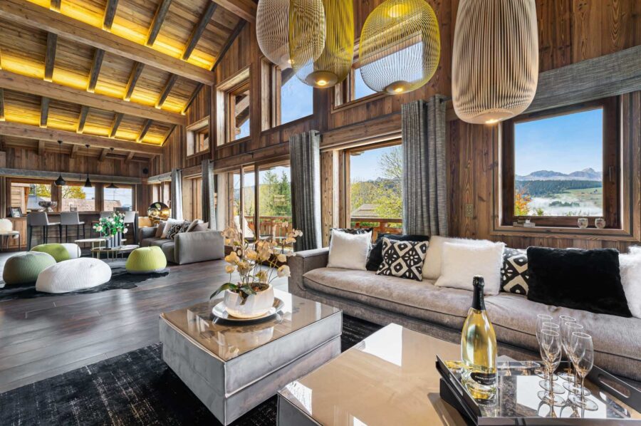 chalet-olga-livingroom-mountainview-openplan-highceiling-beams-modern-alpine-luxury-elegant-design-megeve