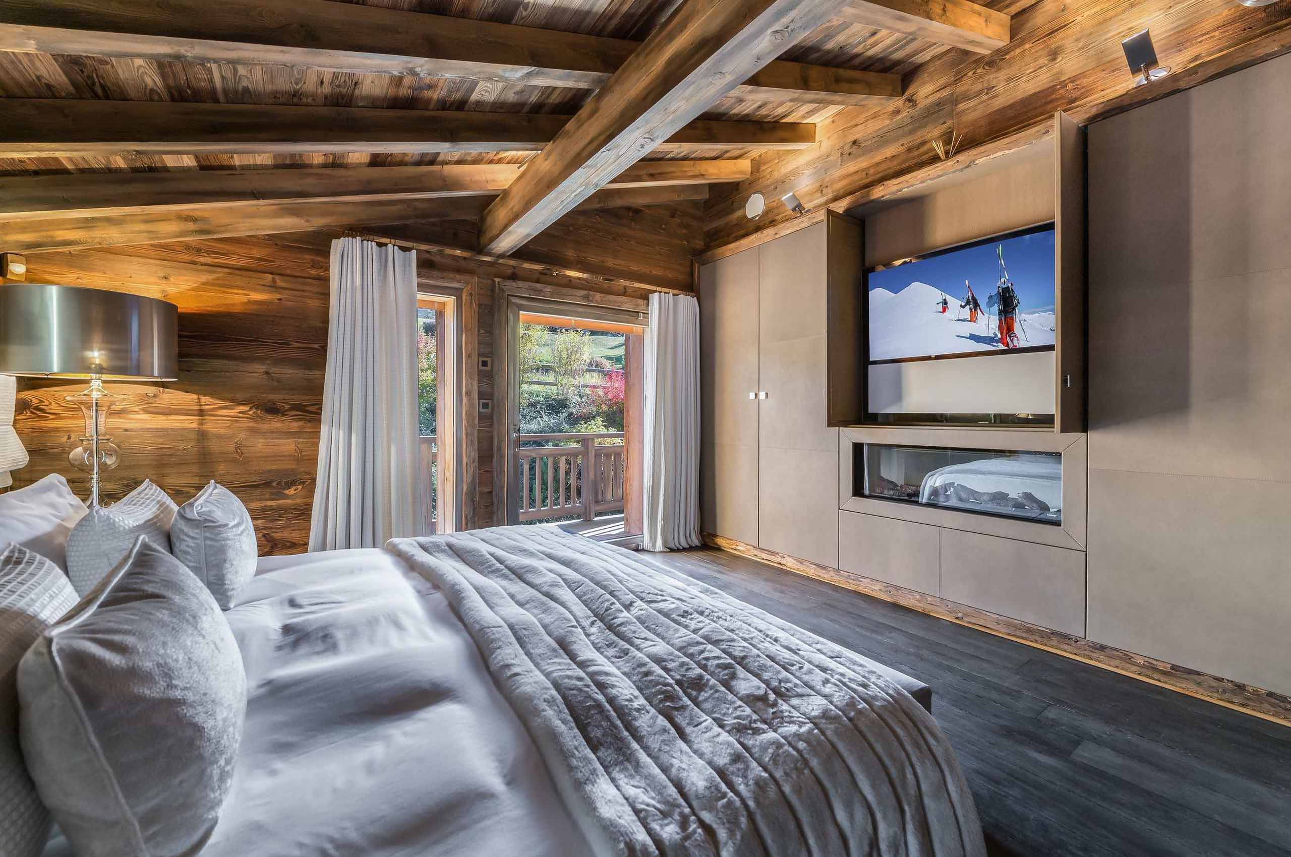 chalet-sabine-bedroom-balcony-tv-modern-alpine-elegant-design-megeve